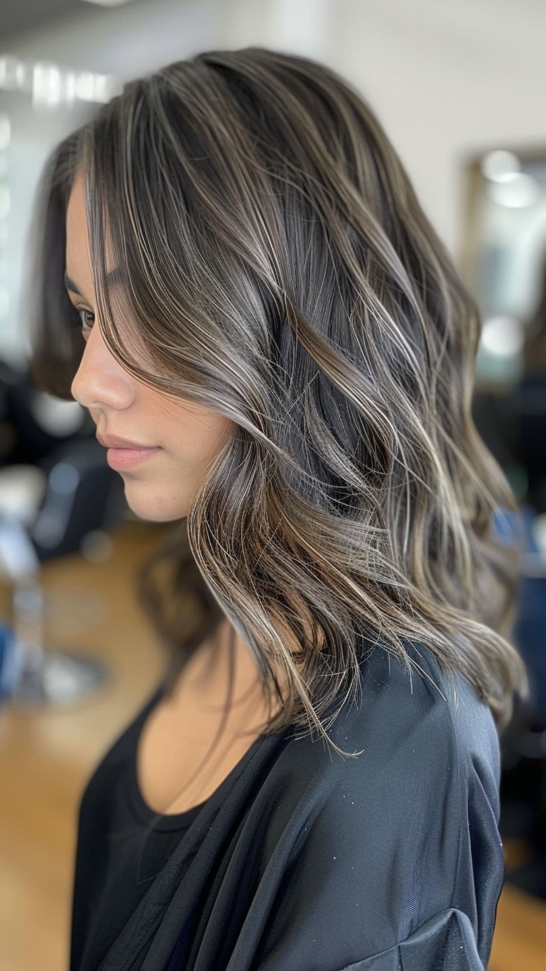 A woman modelling a mushroom brown hair.