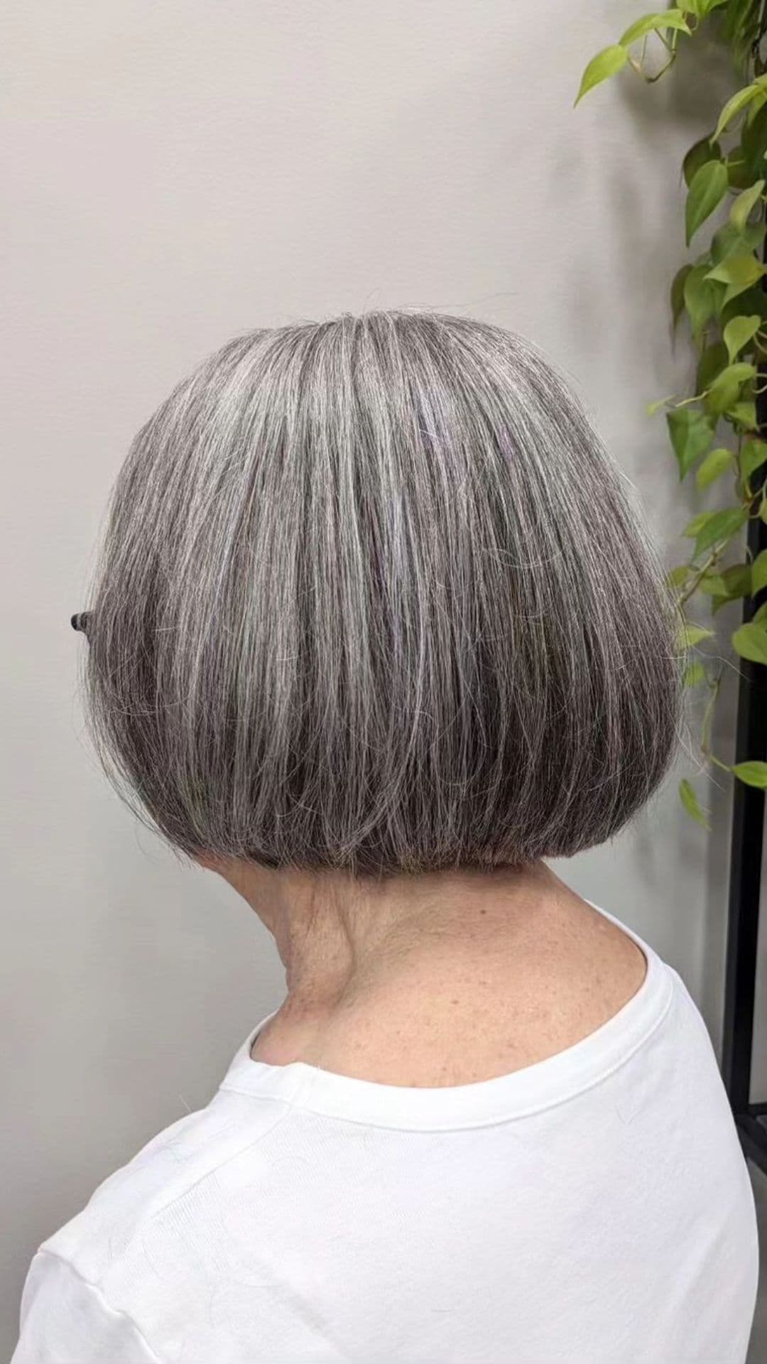 An older woman modelling a classic bob haircut.