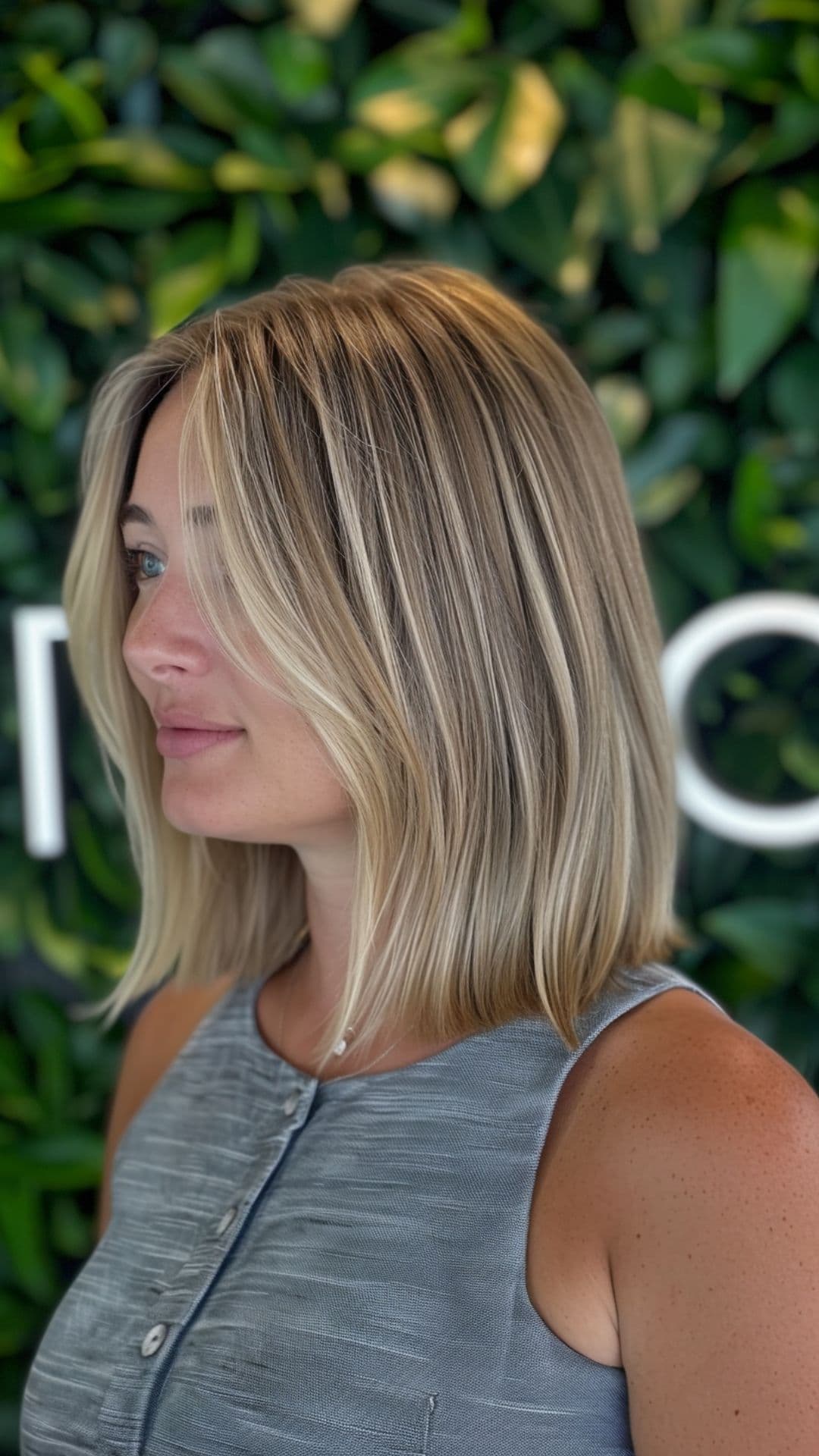 A woman modelling a biscuit blonde hair.