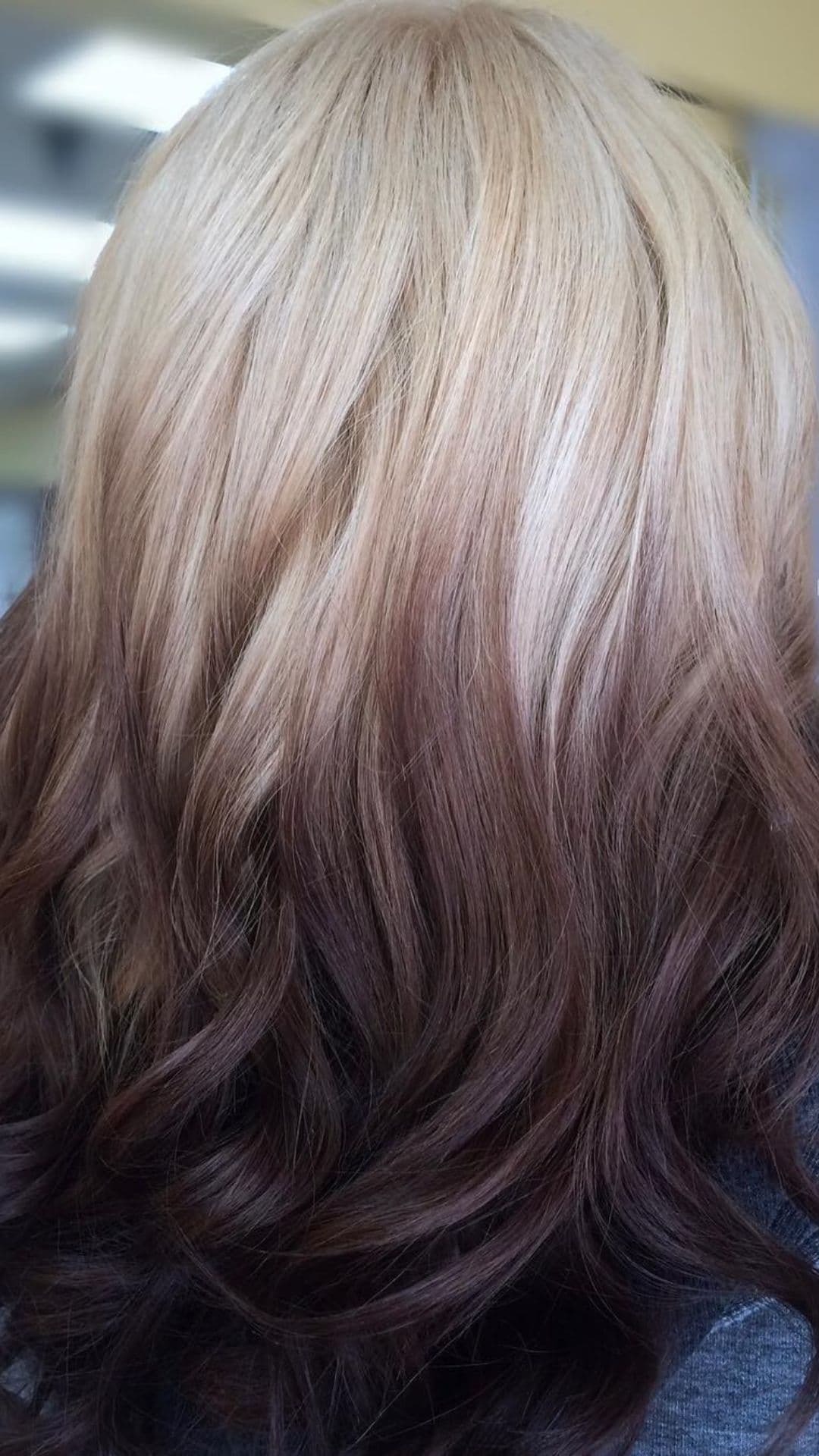 A woman modelling a blonde to chocolate brown ombre.