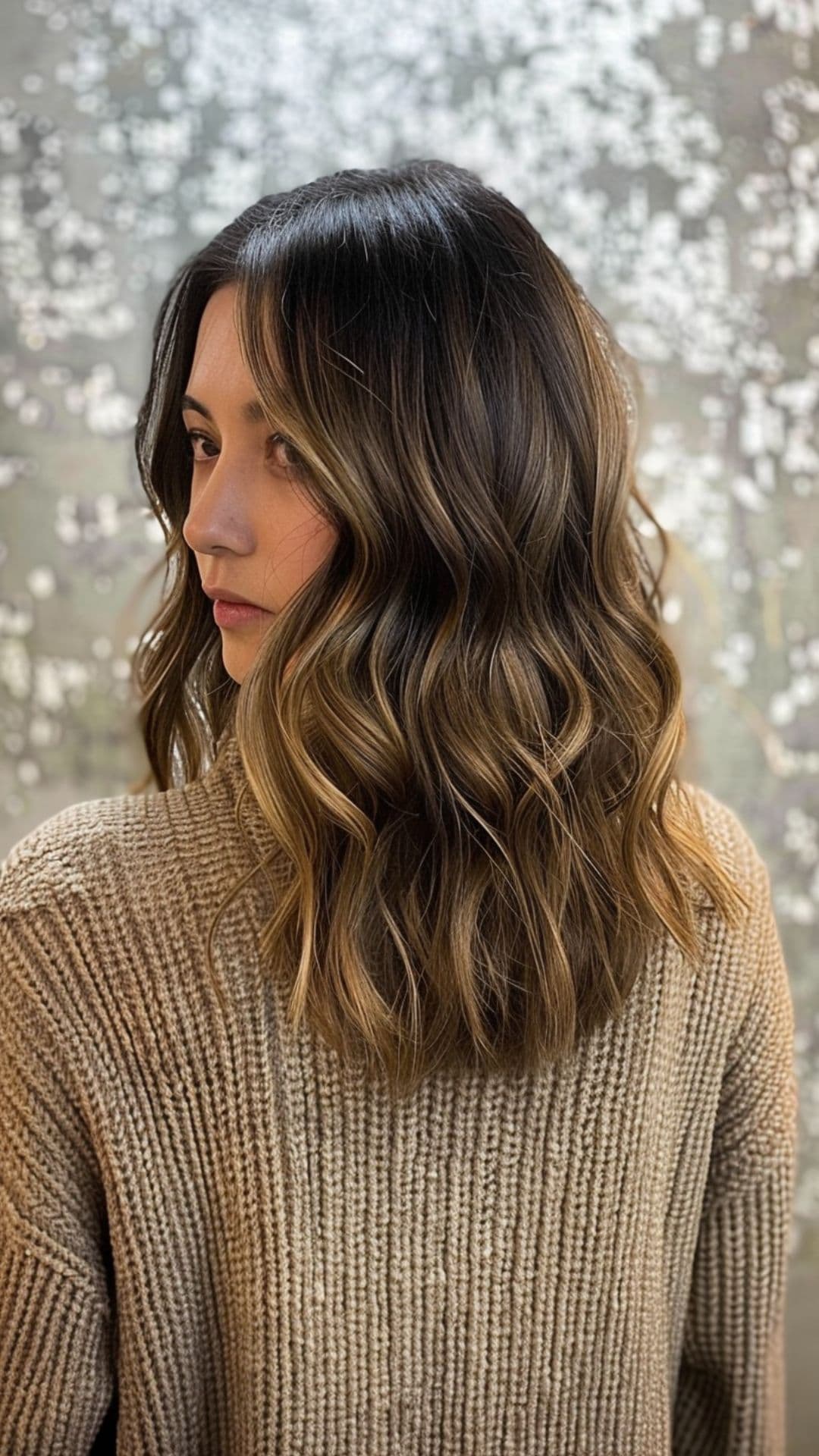 A woman modelling a brown sugar milk tea hair.