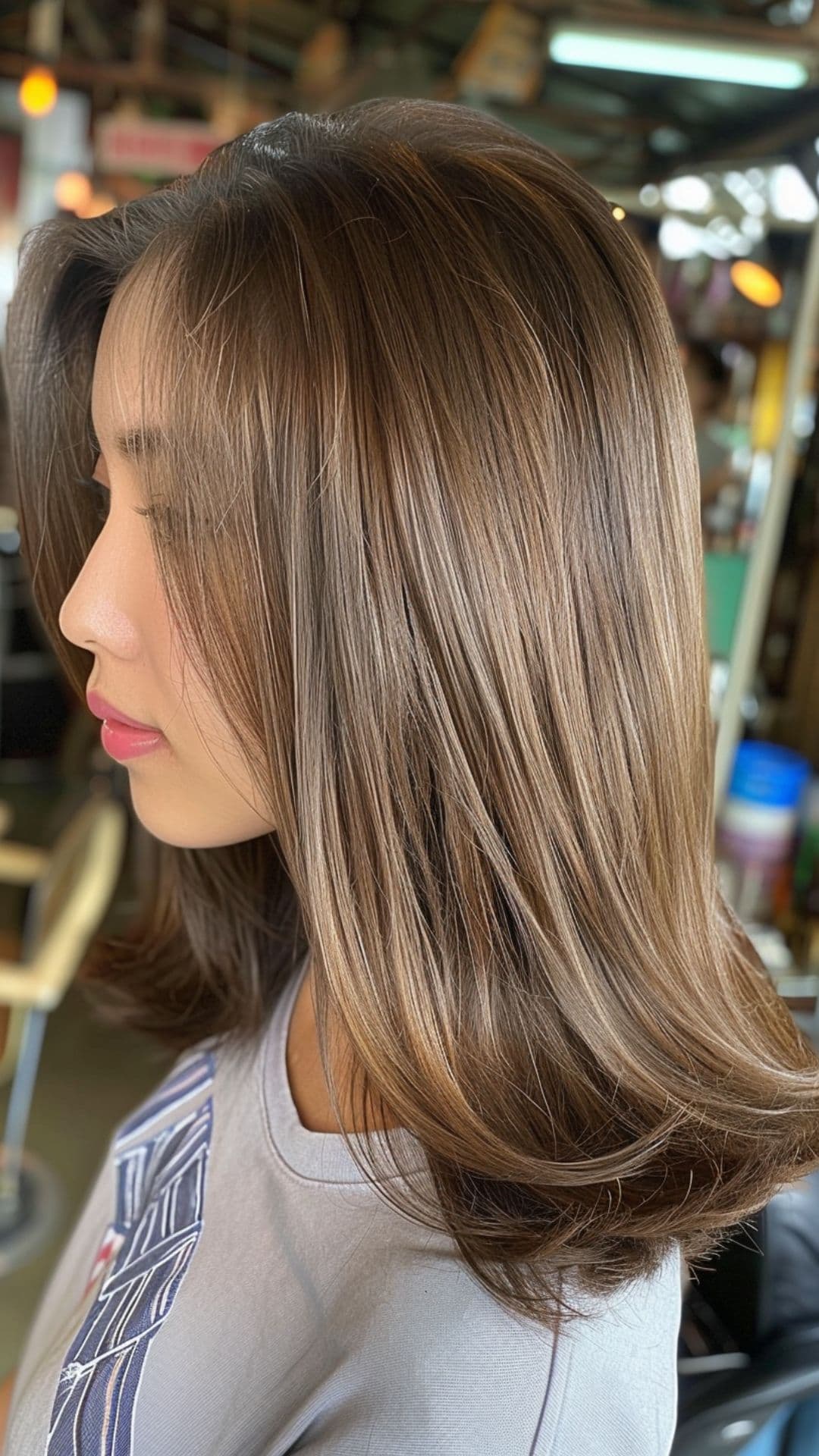 A woman modelling a caramel milk tea brown hair.