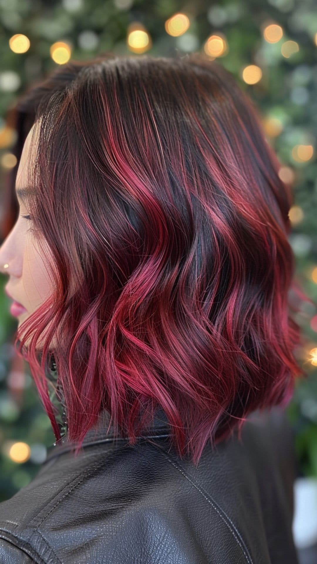 A woman modelling a cherr balayage lob.