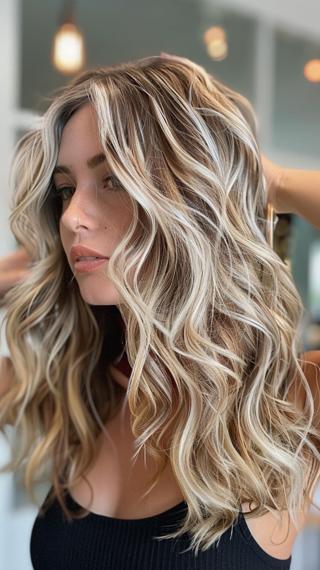 A woman modelling a chunky platinum highlights hair.