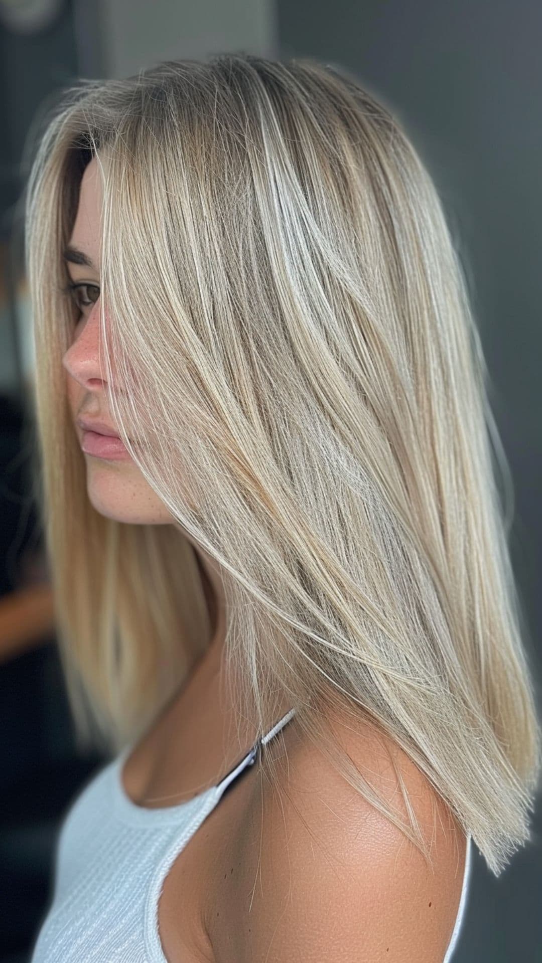 A woman modelling a classic ash blonde hair.