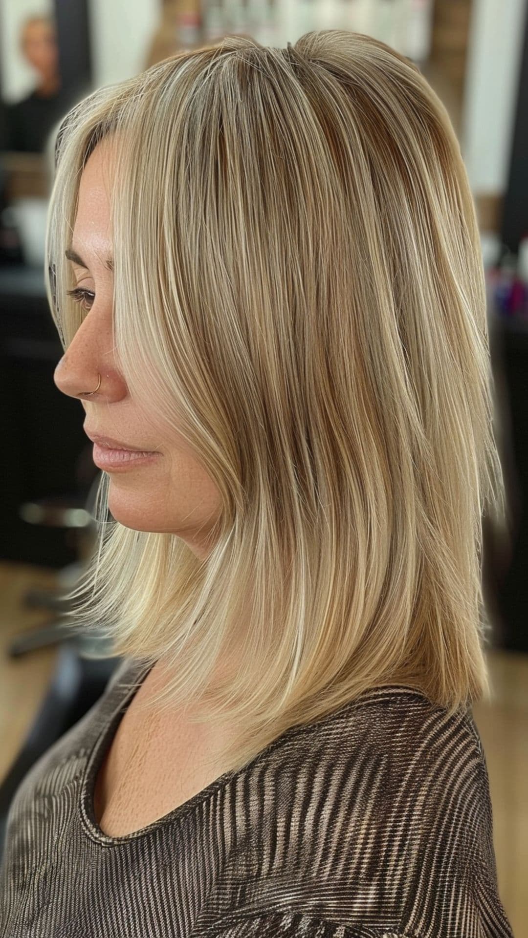 A woman modelling a cool beige blonde hair.