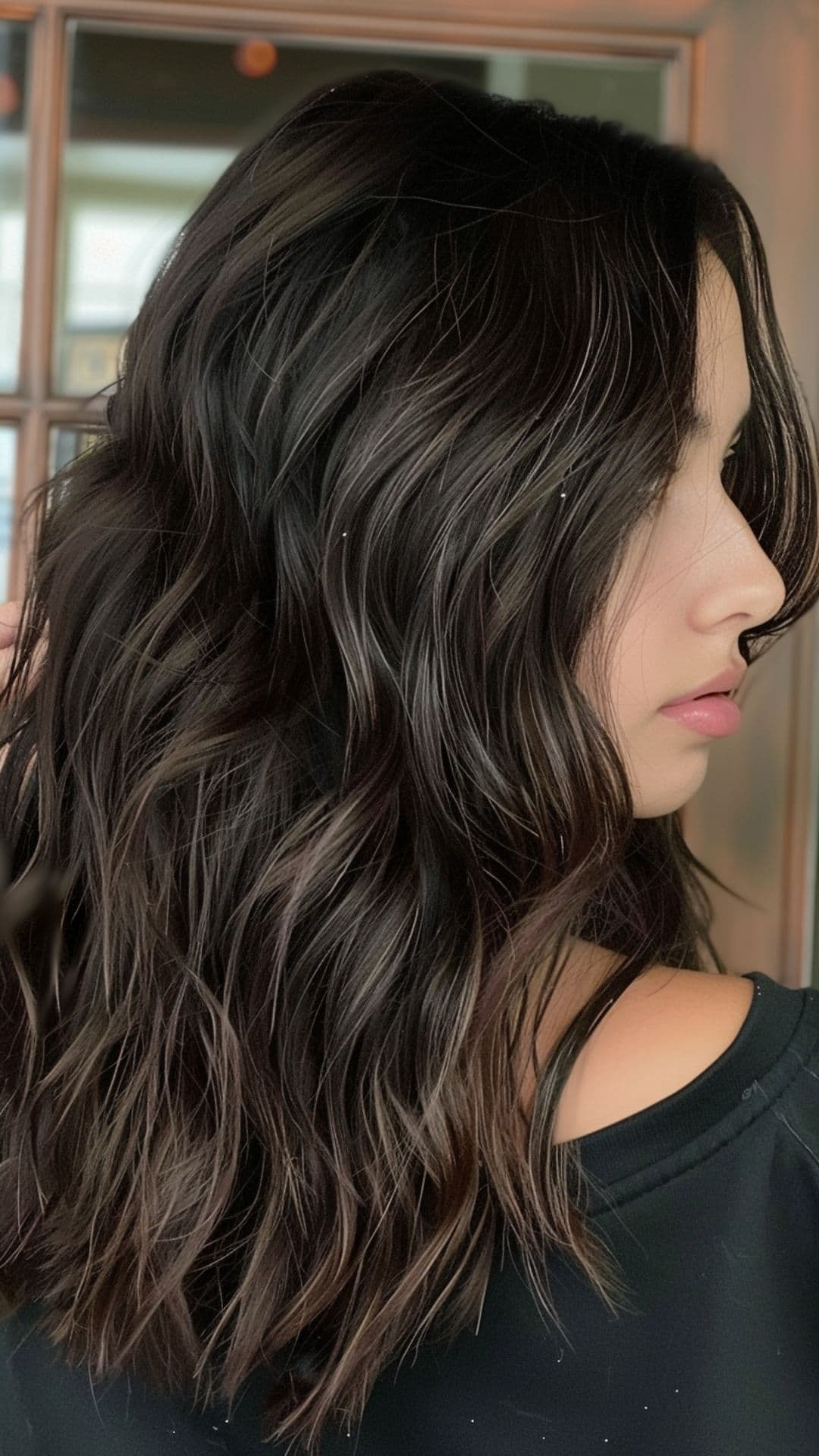 A woman modelling a dark espresso hair.