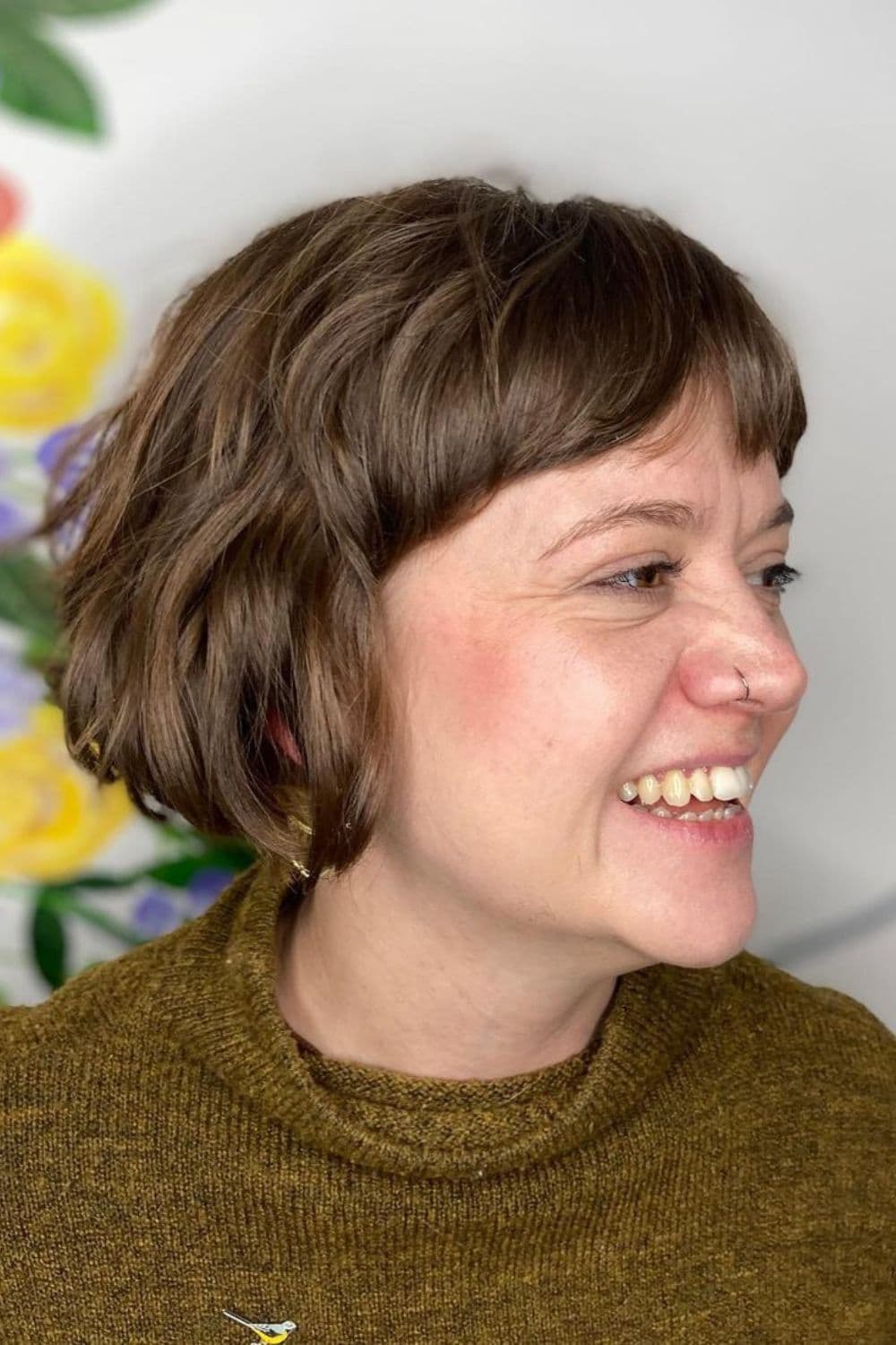 A woman with wavy French bob.