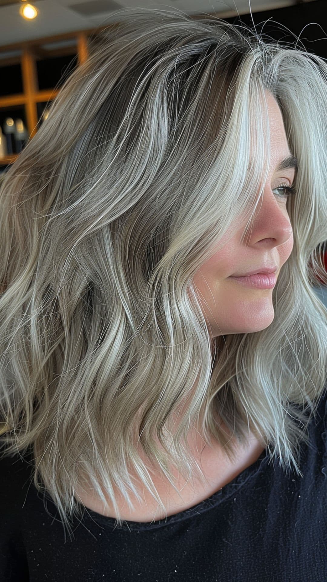 A woman modelling a frosted silver hair.