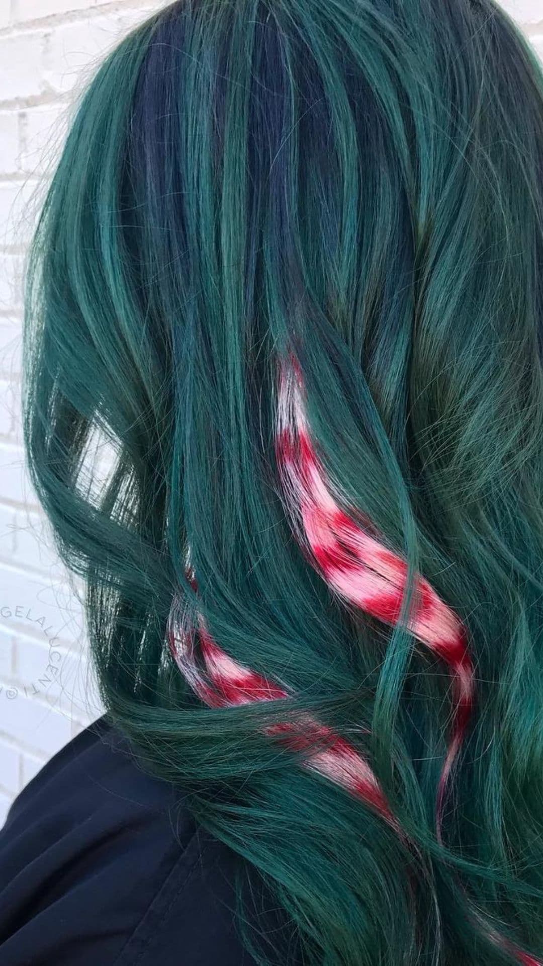 A woman modelling a Green Hair with Candy Cane Peek-a-Boo hairstyle.