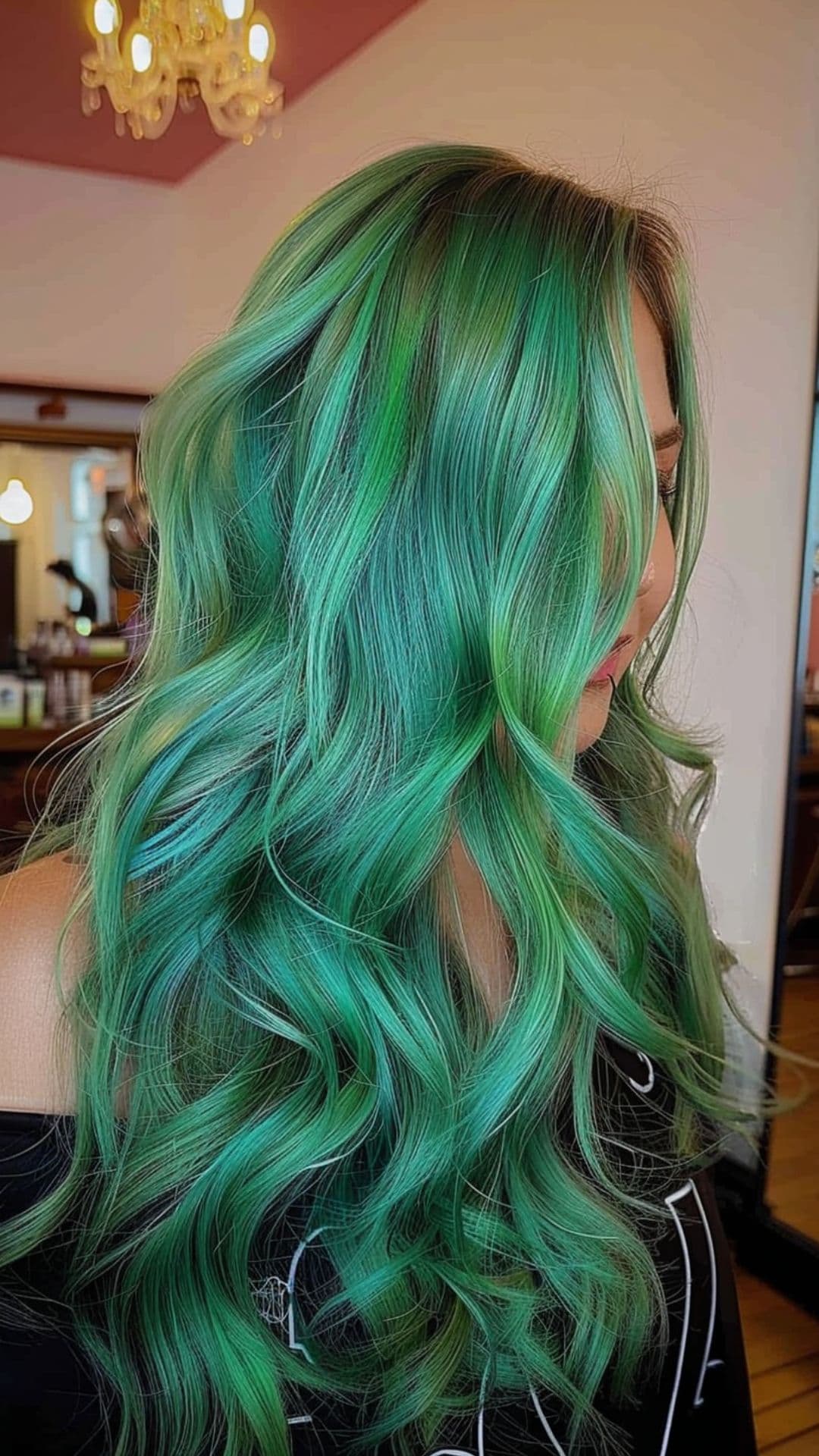 A woman modelling a green and blue blend hair.