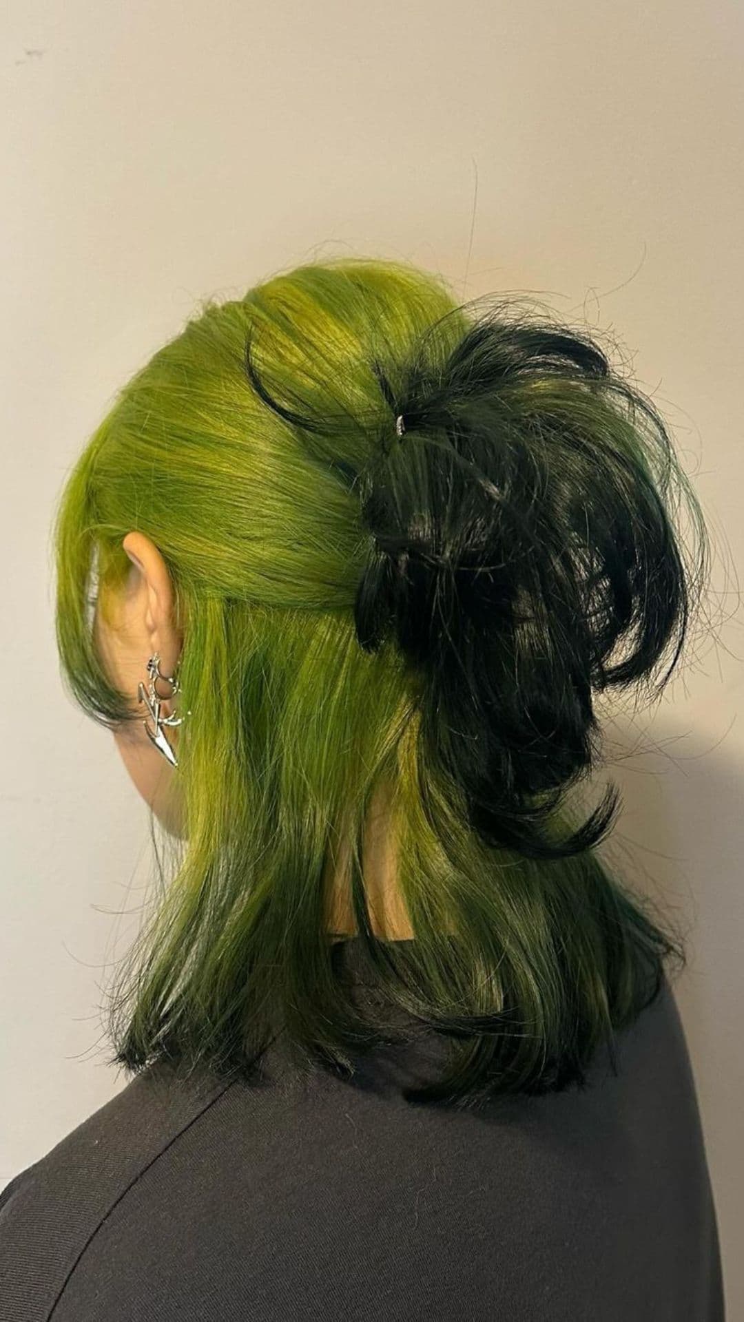 A woman modelling a green to black ombre.