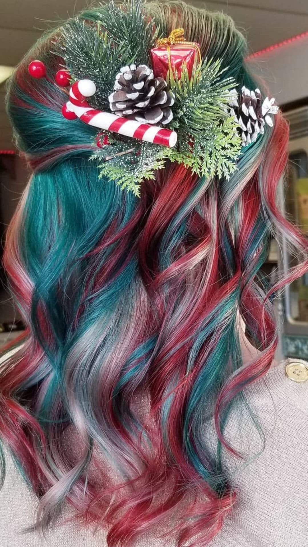 A woman modelling a Half-Up Half-Down Red and Green Christmas Hair.