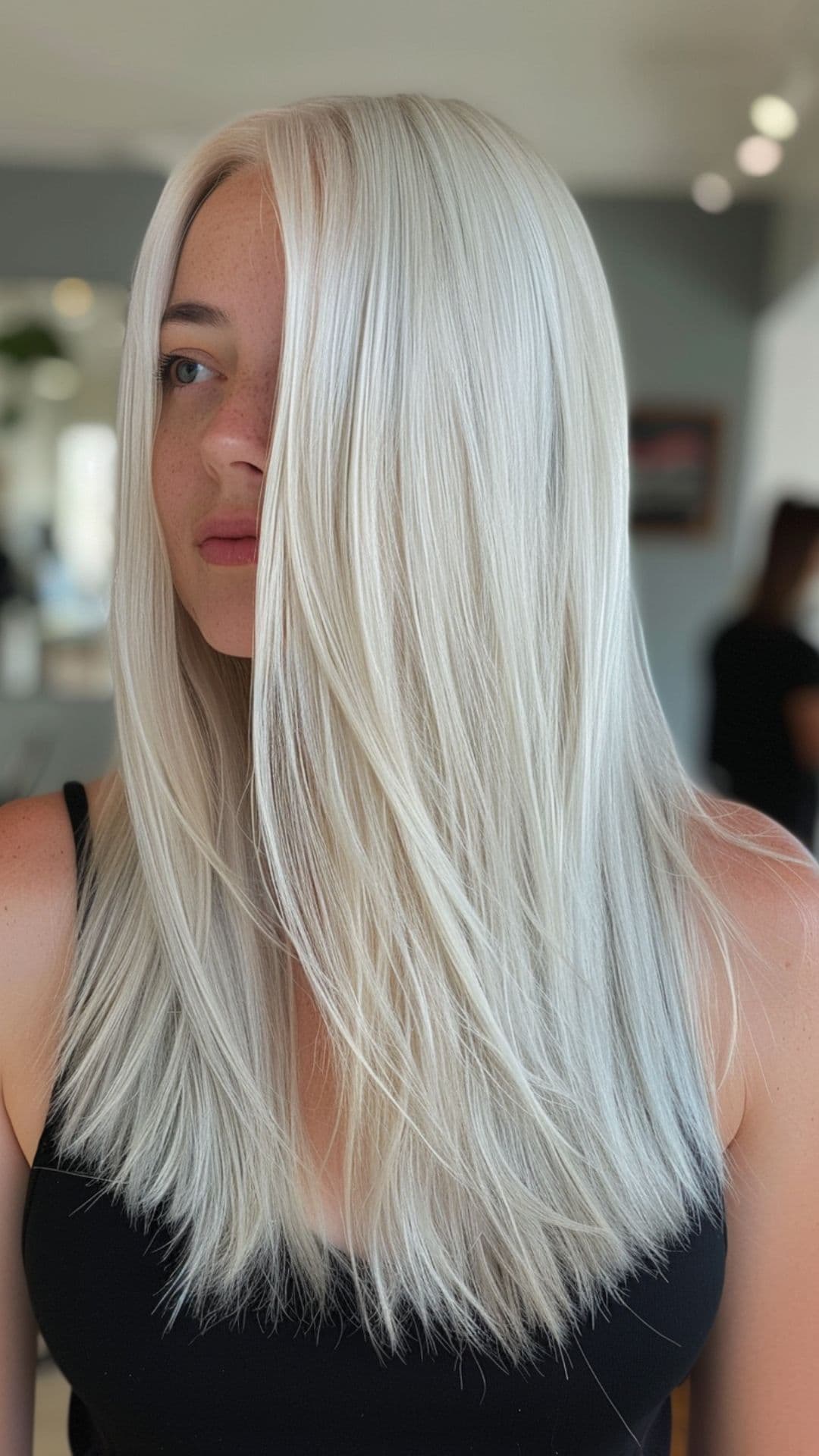 A woman modelling an icy platinum blonde hair.