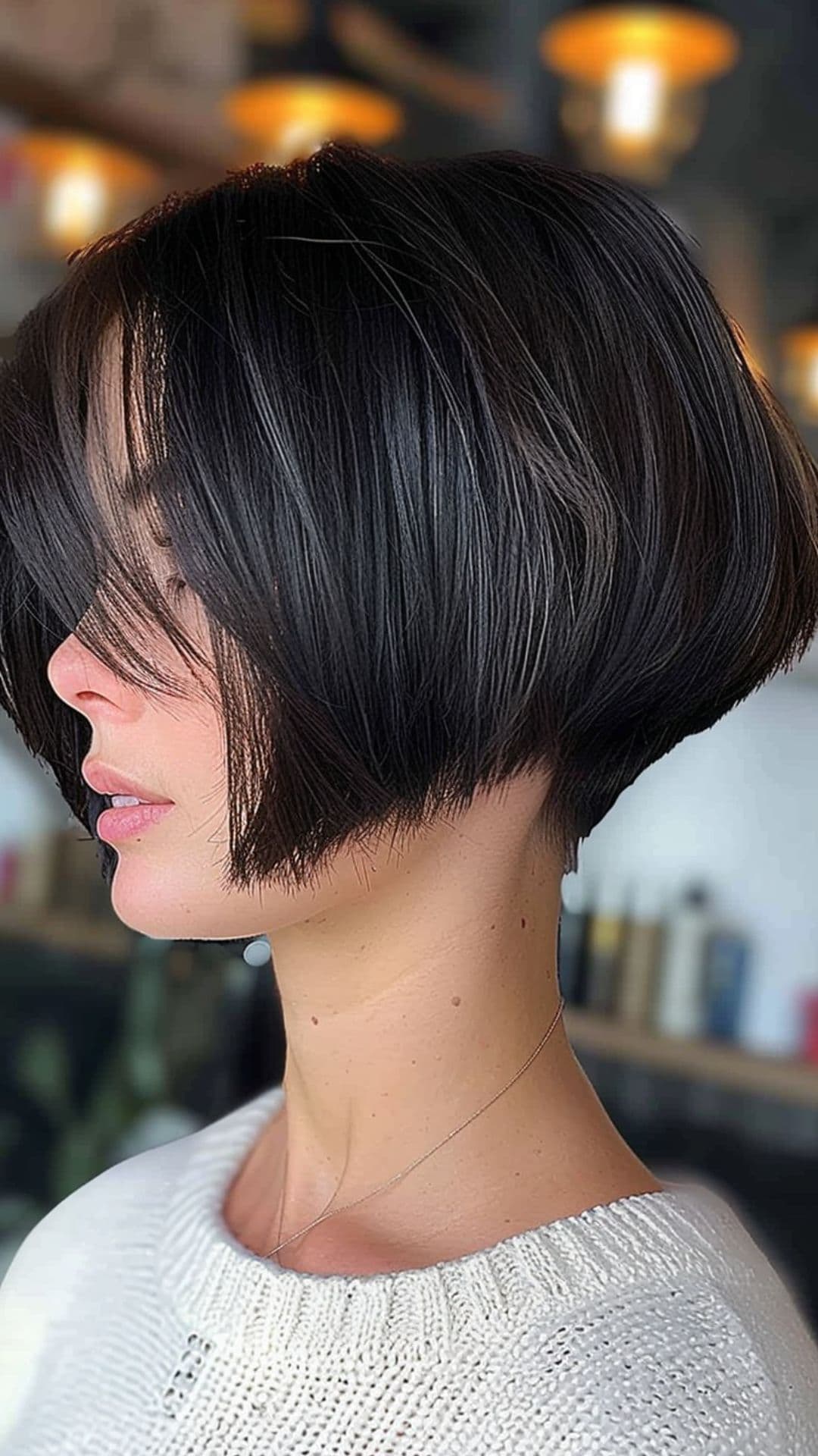 A woman modelling a layered bob with undercut.