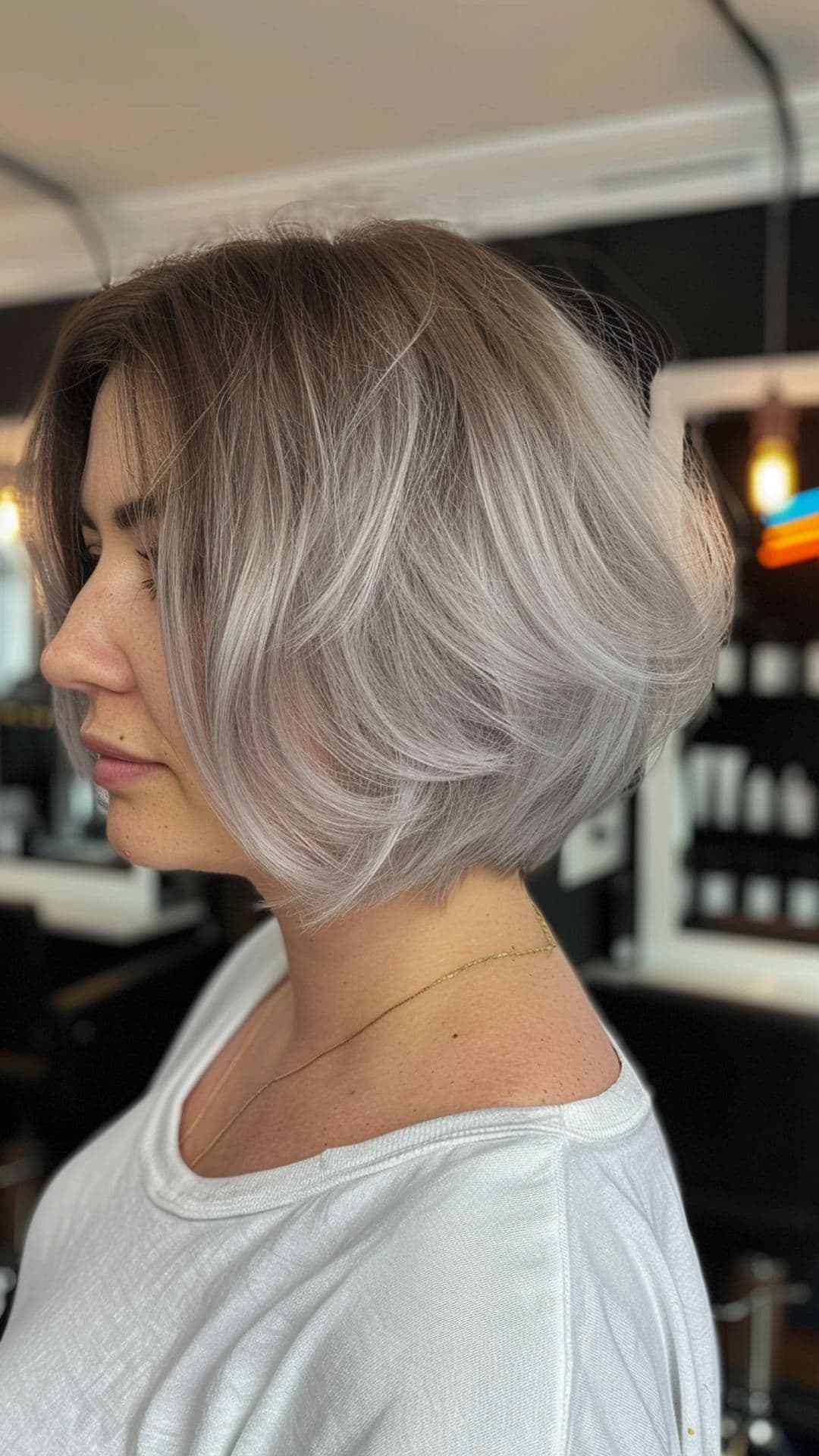 A woman modelling a layered inverted bob.