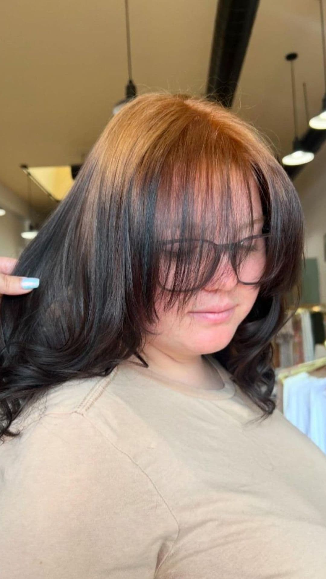 A woman modelling a light brown to black ombre.