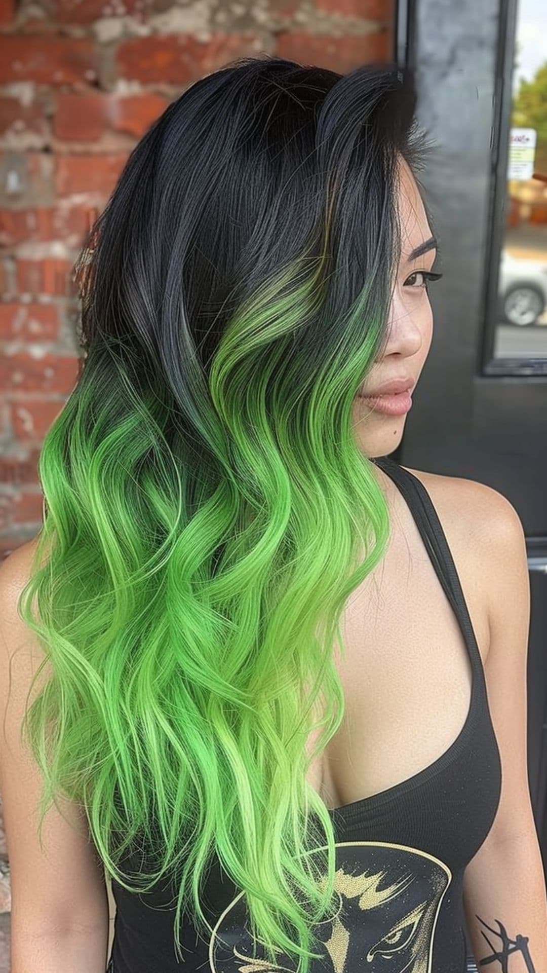 A woman modelling a black to lime green ombre hair.