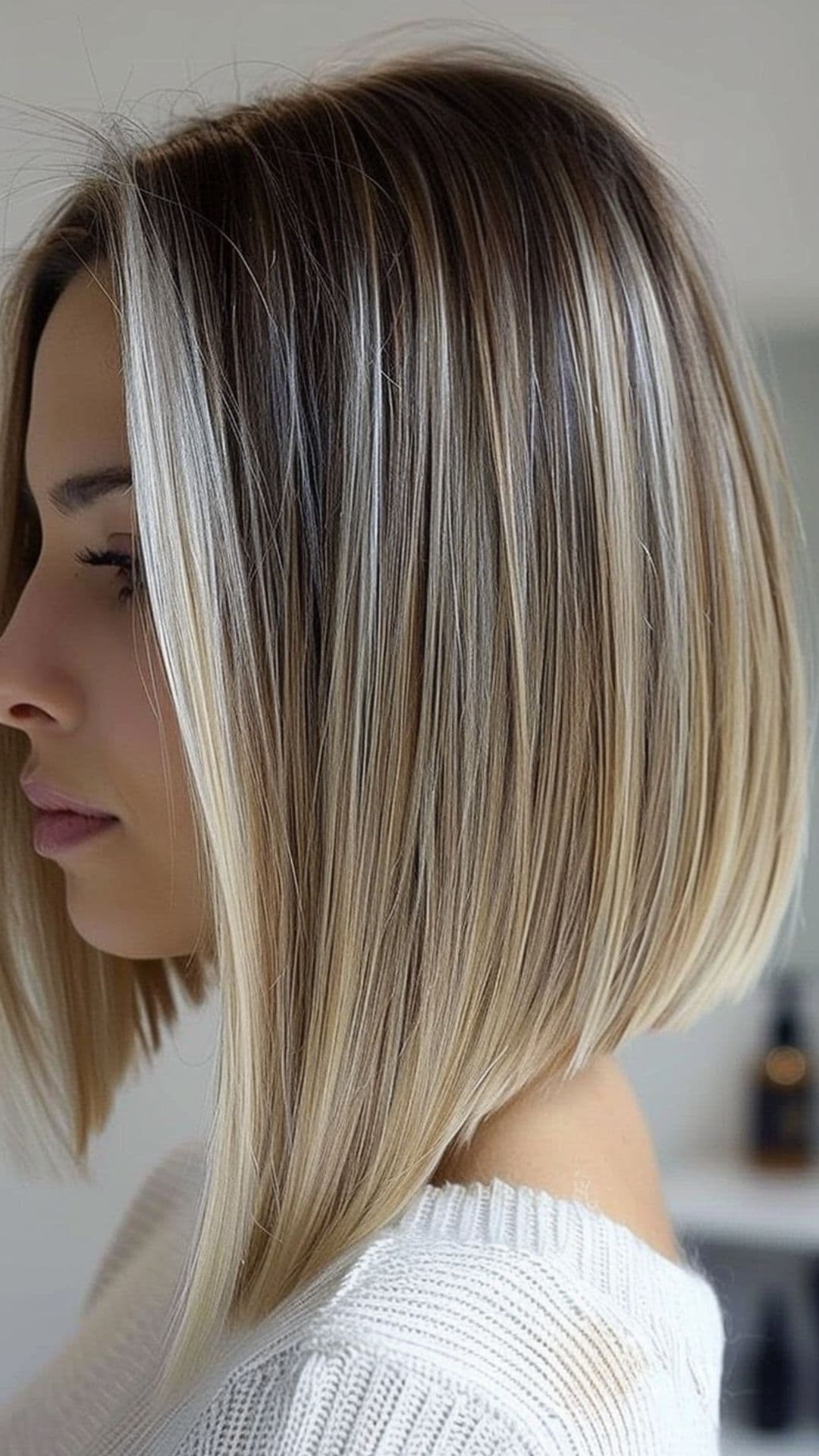 A woman modelling a long inverted bob.