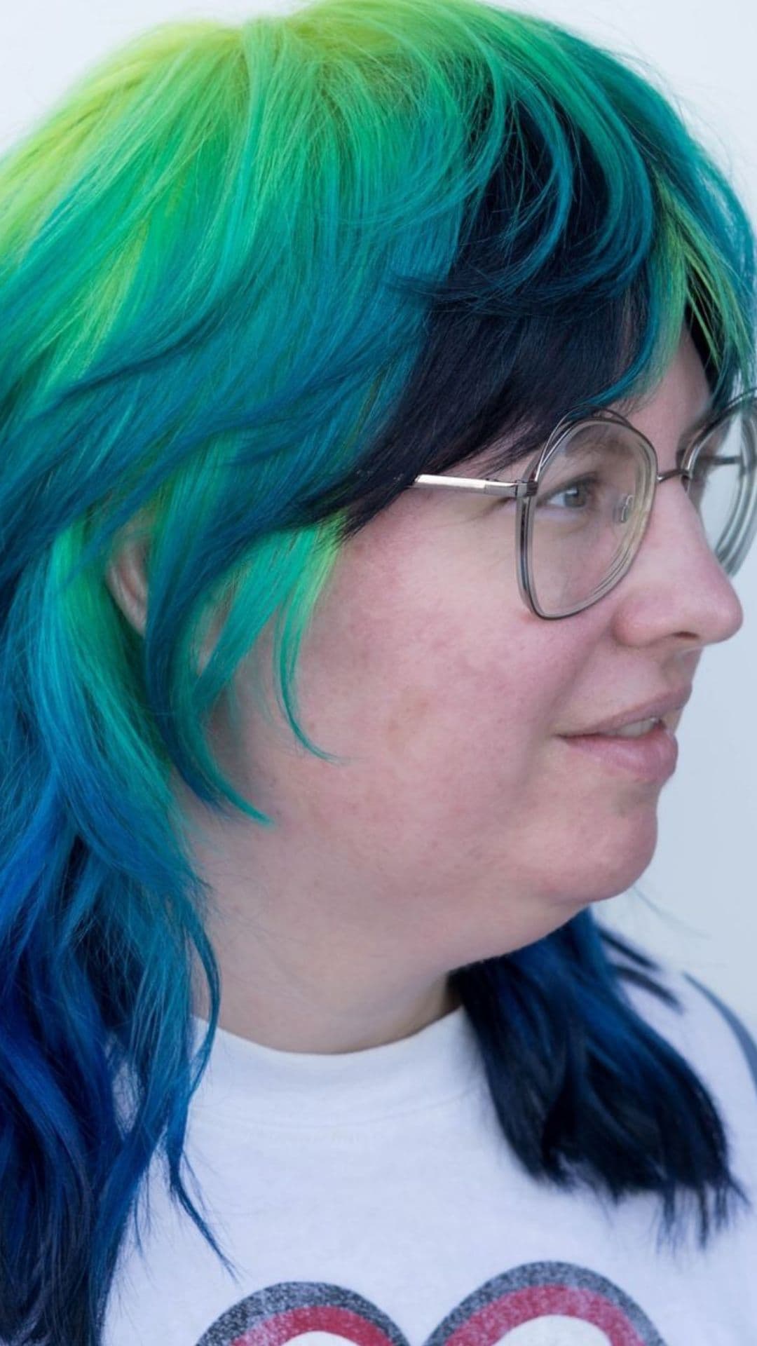 A woman modelling a midnight aurora ombre hair.