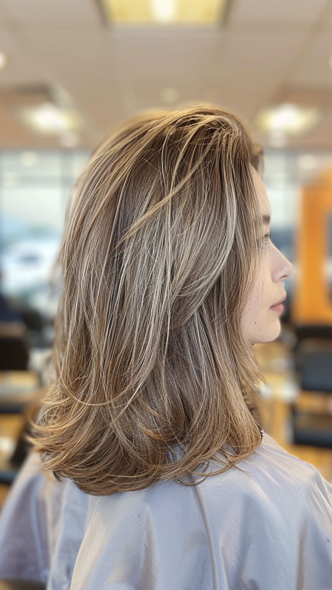 A woman modelling a milk tea latte hair.