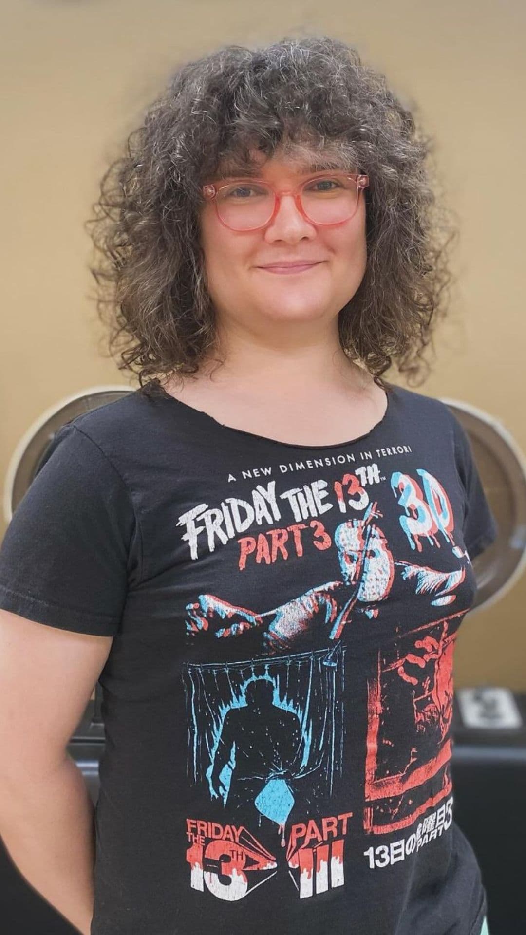 An older woman modelling a naturally curly shag hairstyle.