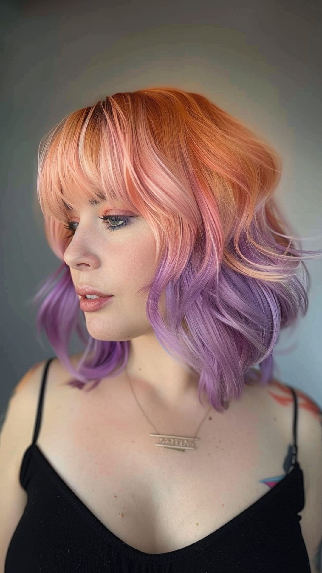 A woman modelling a peach and lavender hair.