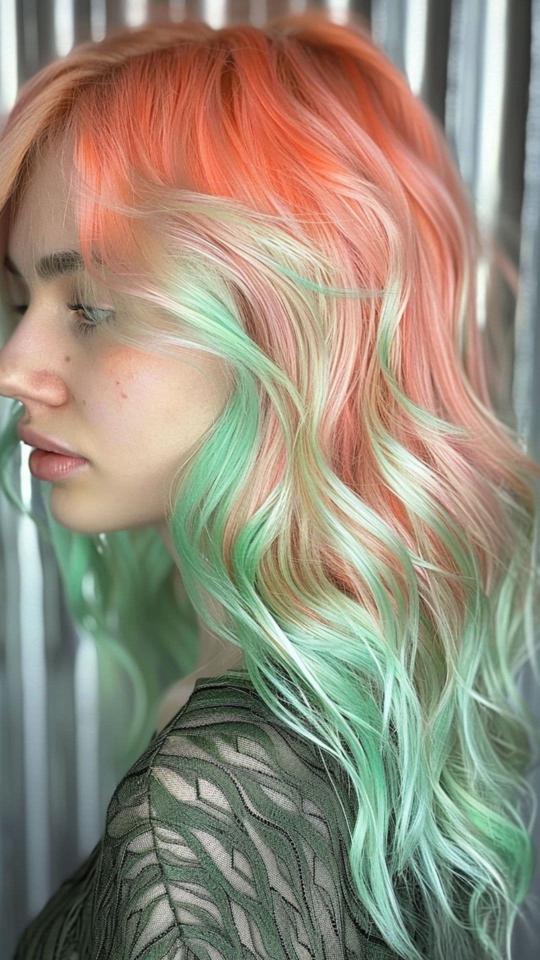 A woman modelling a peach and mint hair.