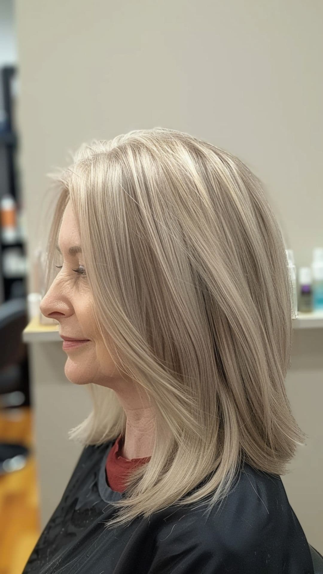 An old woman modelling a pearl blonde shoulder-length straight hair.