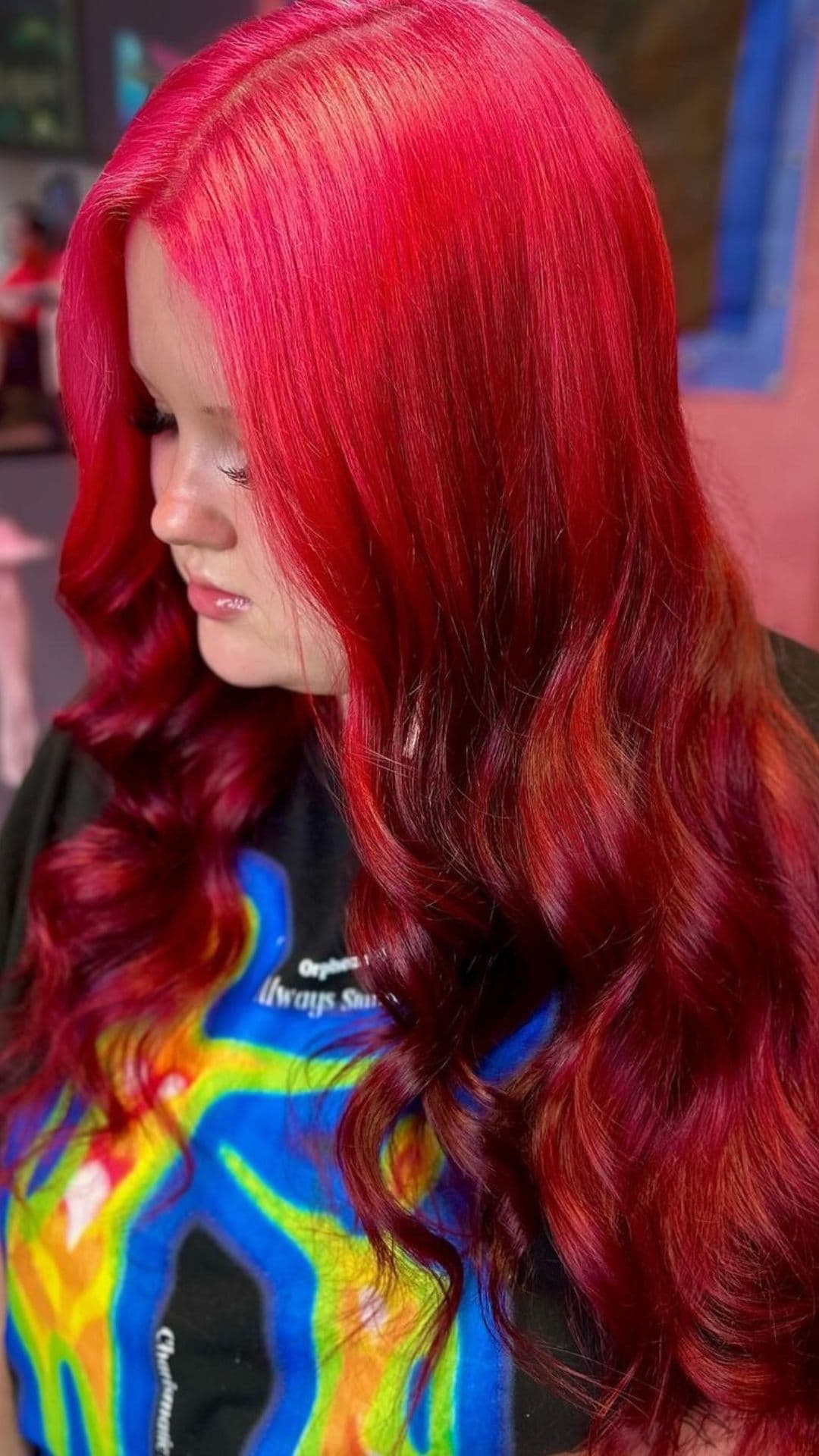 A woman modelling a pink to red ombre.