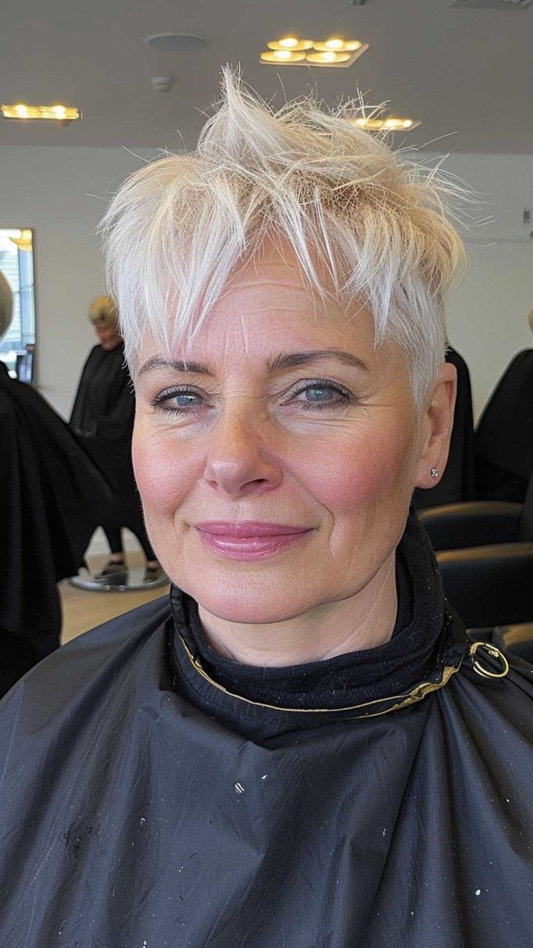 An old woman modelling a platinum blonde pixie cut.