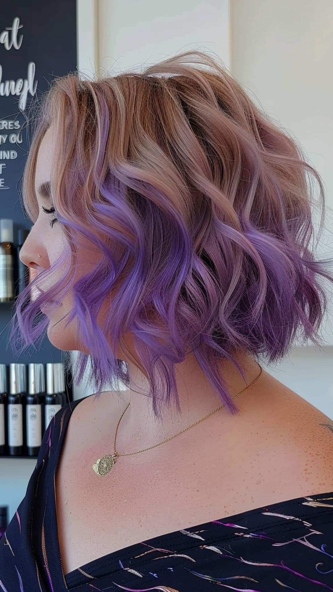 A woman modelling a purple ombre hair.