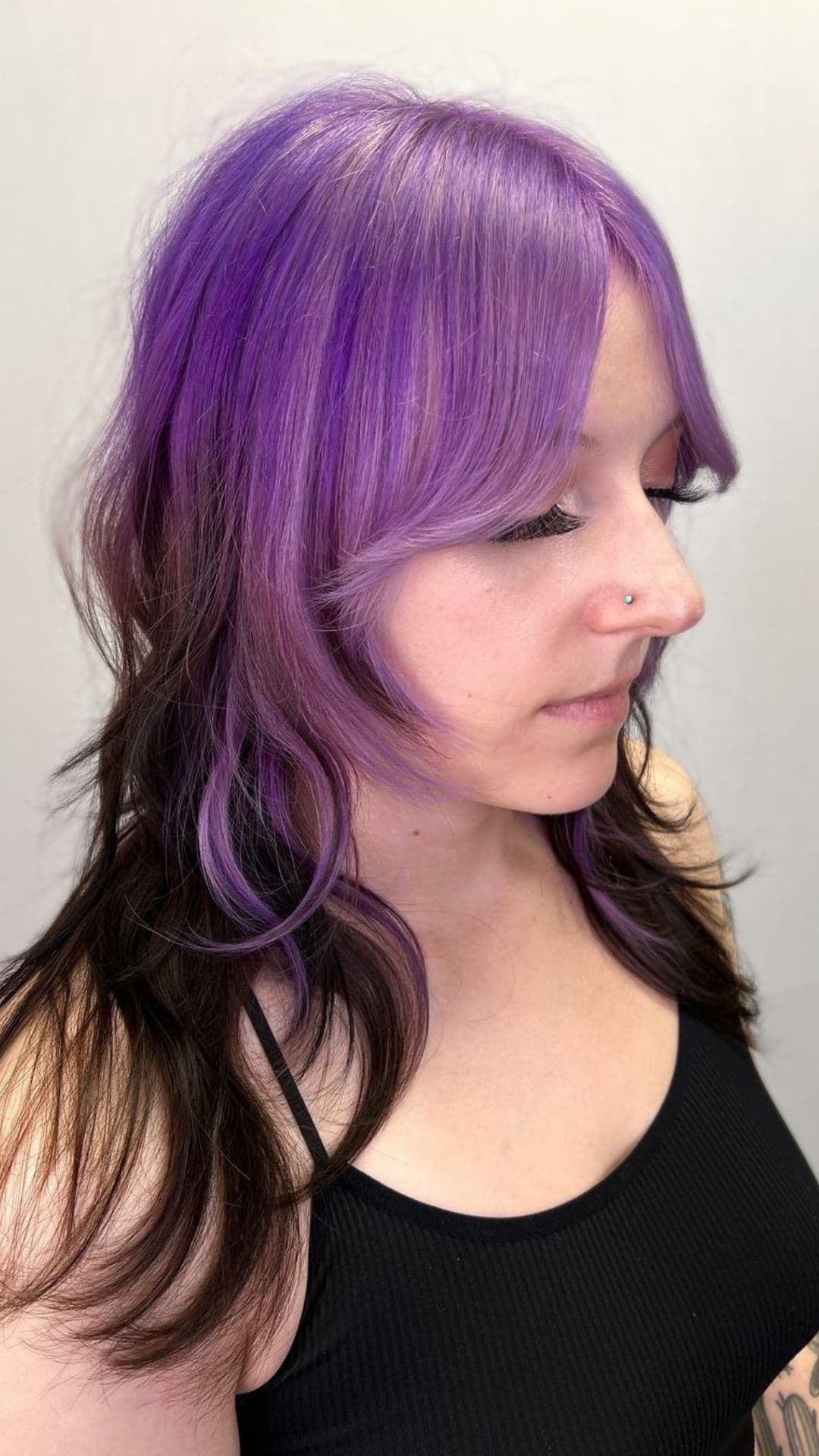 A woman modelling a purple to dark brown ombre.