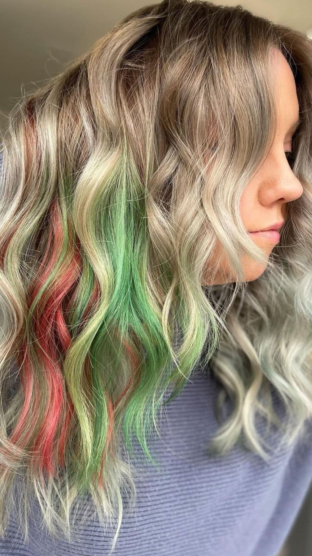 A woman modelling a Red and Green Balayage hairstyle.