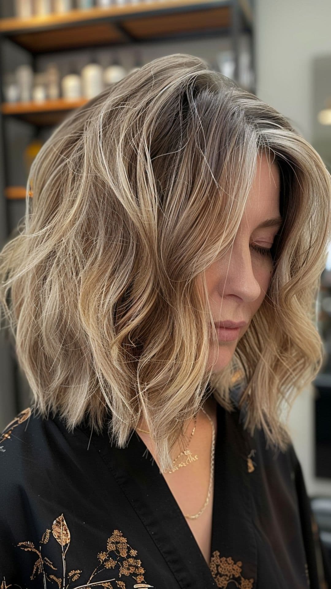 An old woman modelling a sandy blonde balayage.