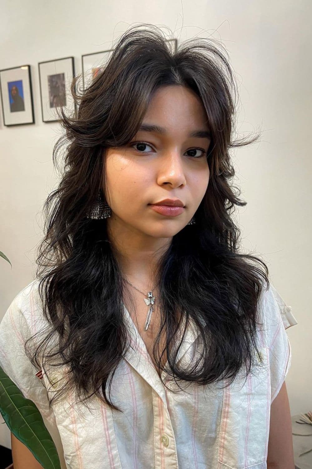 A woman with long shaggy front layers.