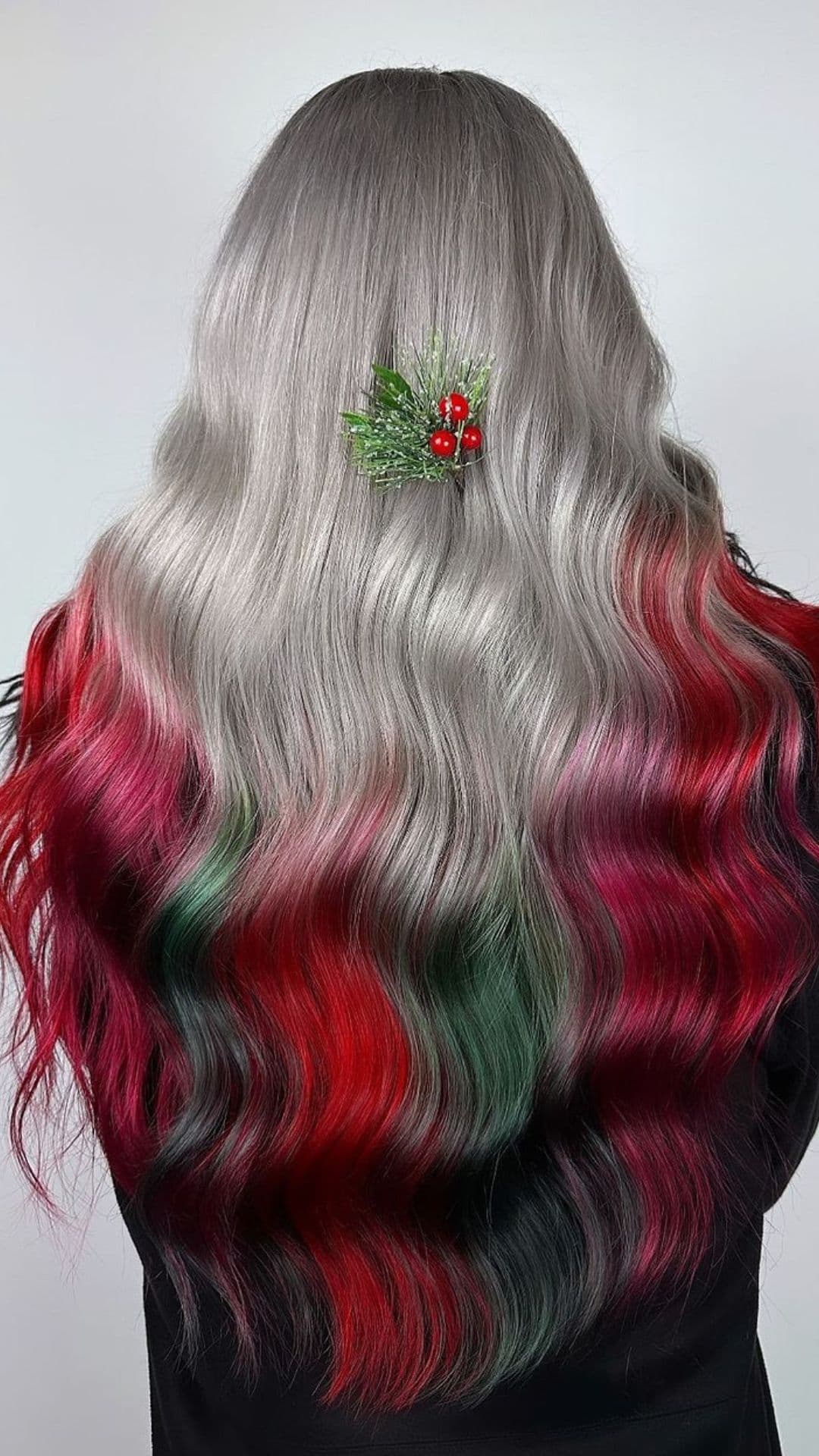 A woman modelling a Silver Hair with Red and Dark Green Ombre hairstyle.