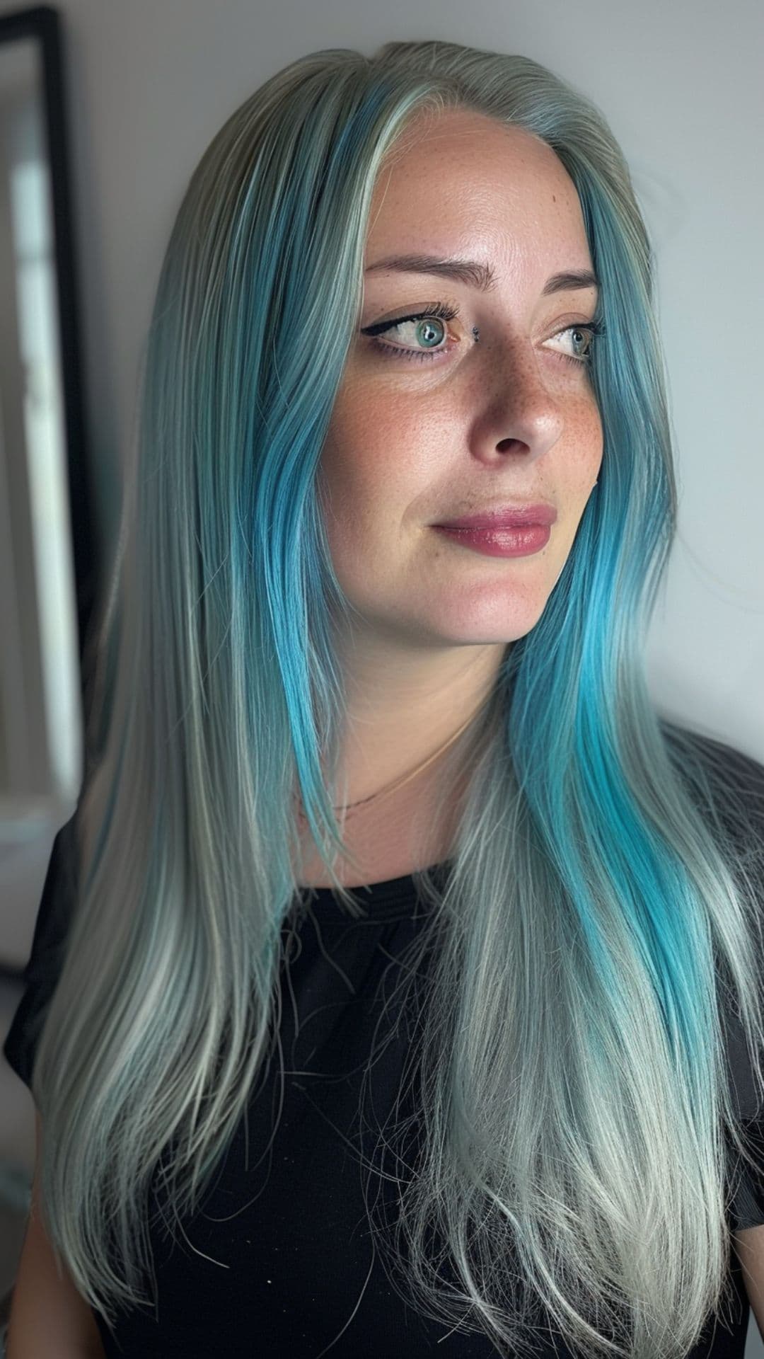 A woman modelling a silver teal hair.