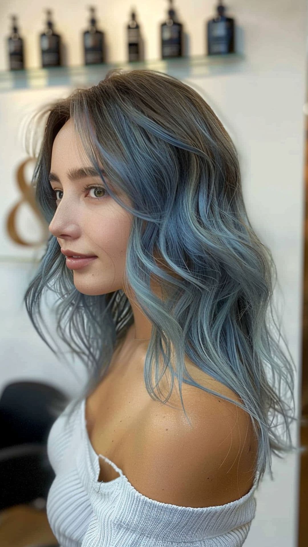 A woman modelling a smoky blue hair.