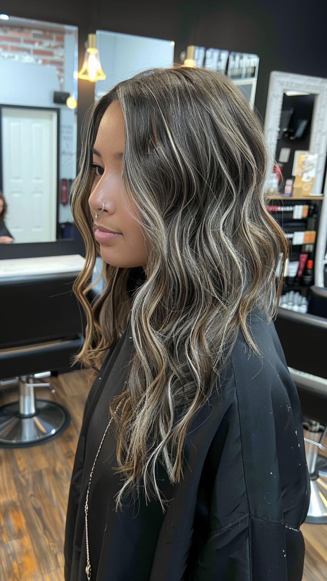 A woman modelling a black hair with ash blonde highlights.