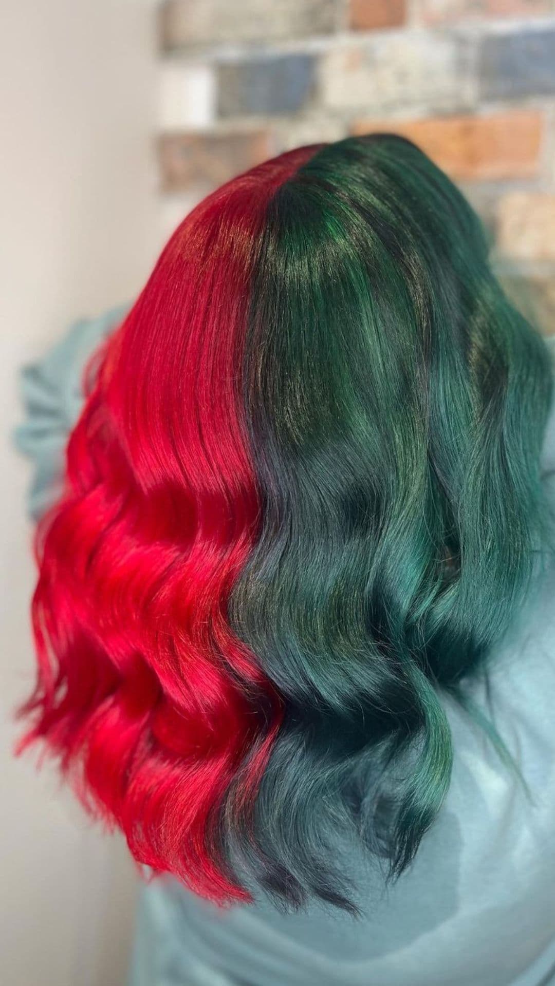 A woman modelling a Split Dye Red and Forest Green Hair hairstyle.