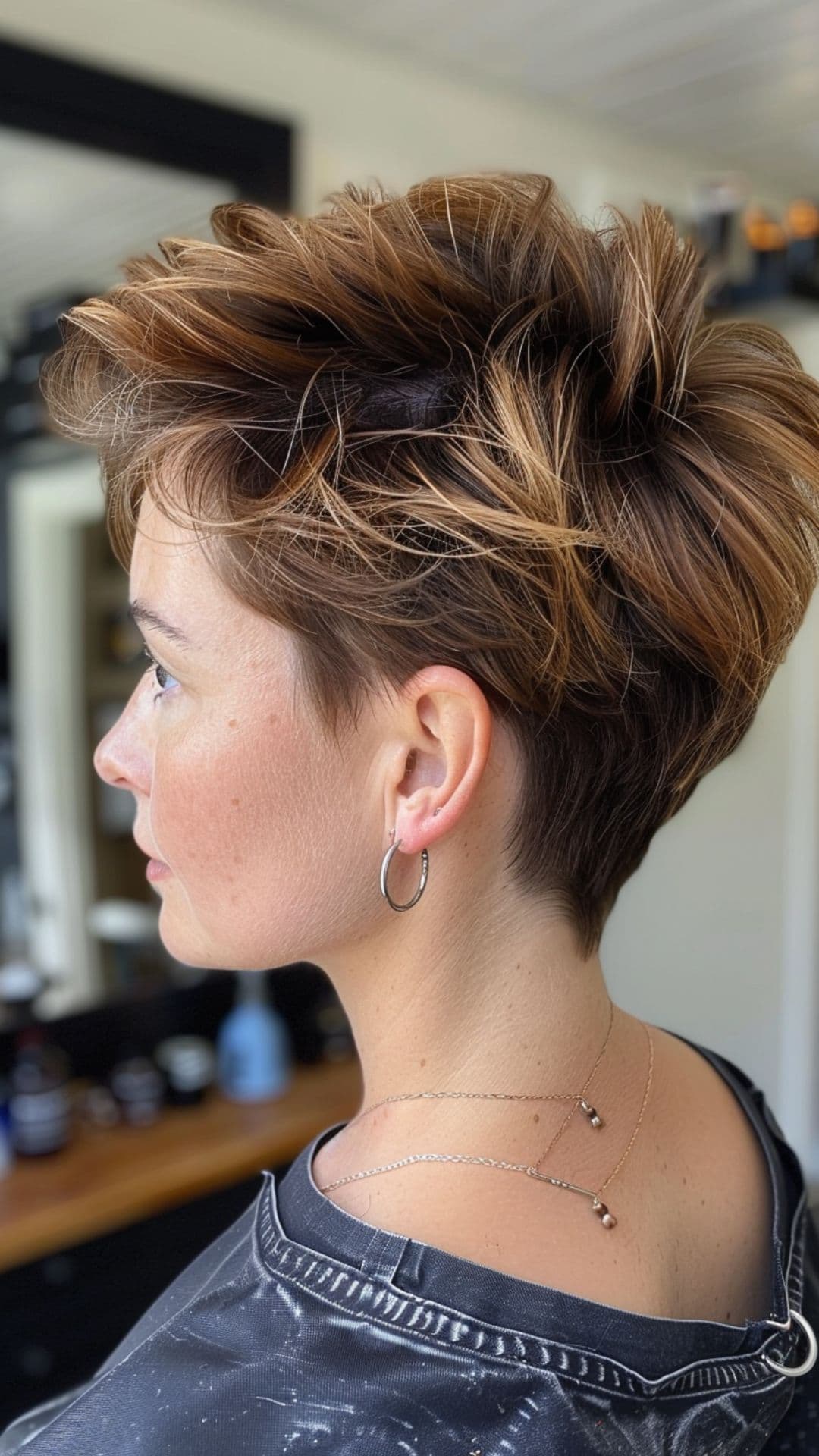 A woman modelling a sunkissed ombre hair.