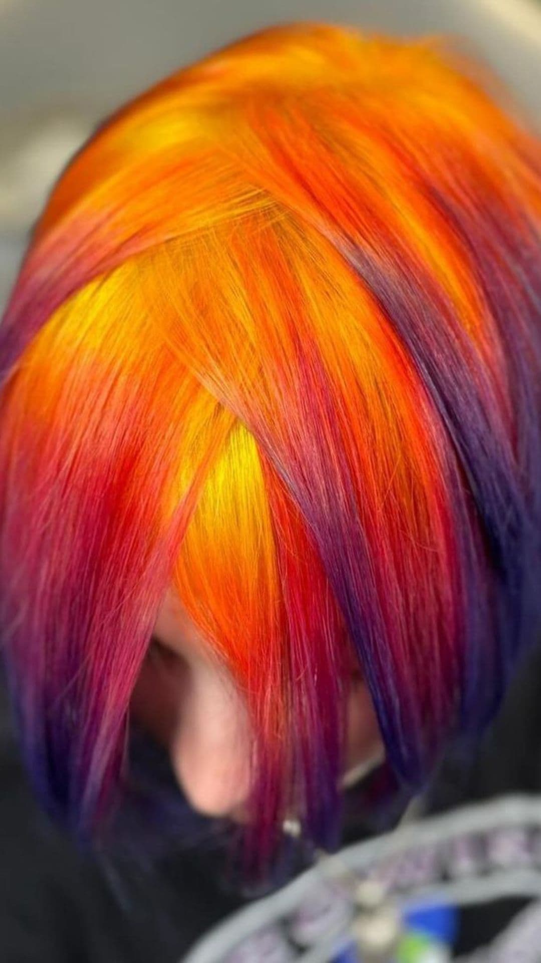 A woman modelling a sunset reverse ombre.