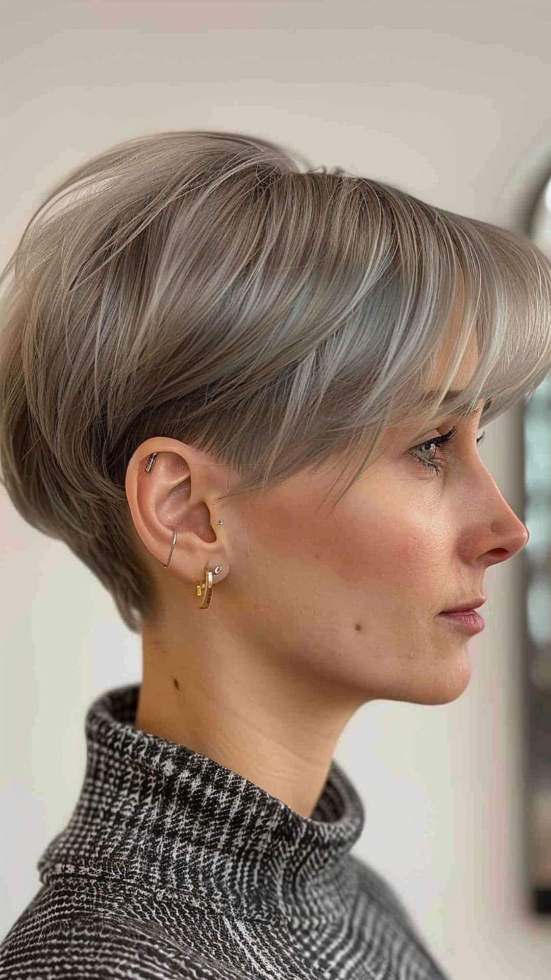 An old woman modelling an undercut pixie bob hair.