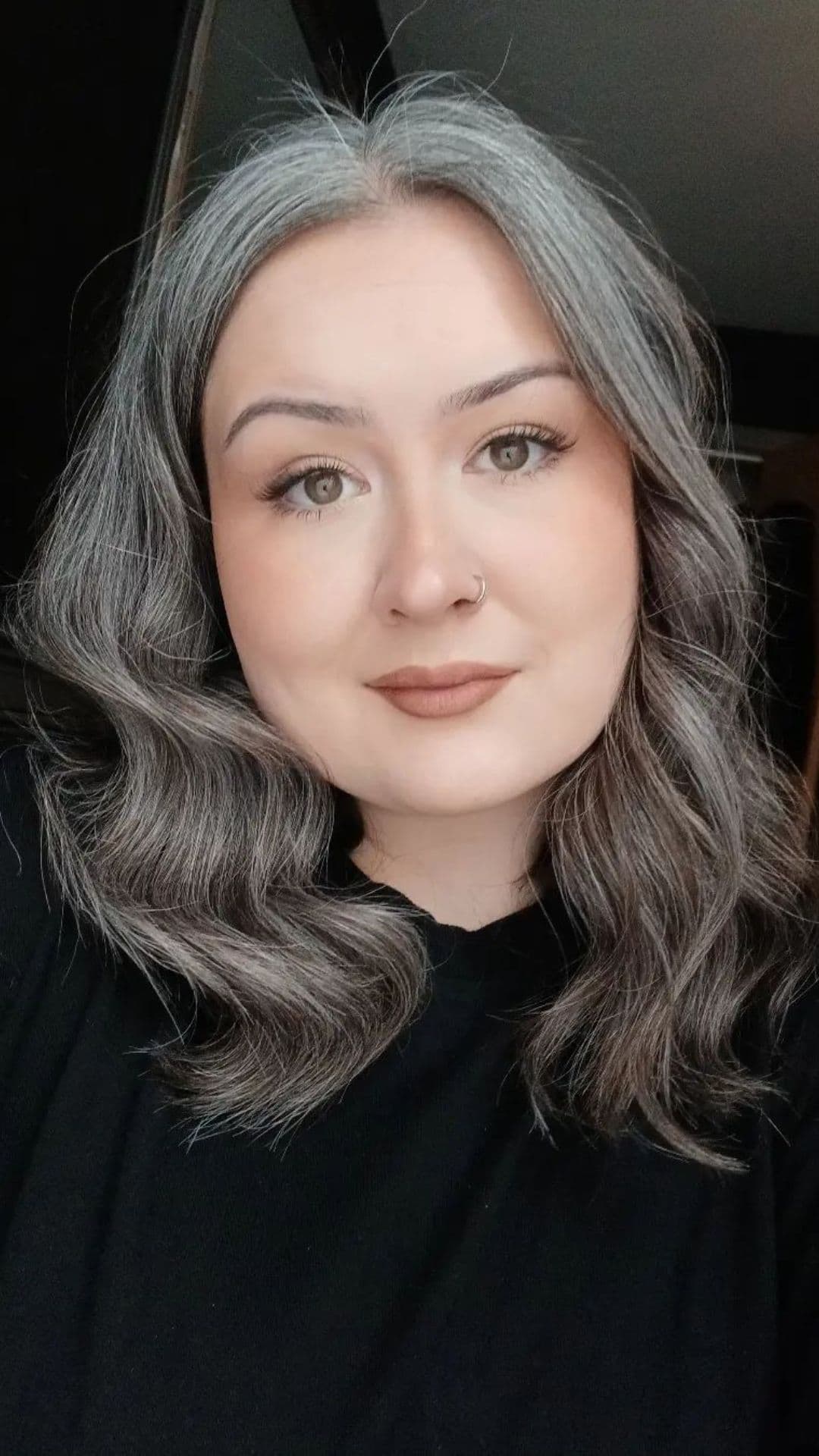 A woman modelling a white and gray ombre hairstyle.