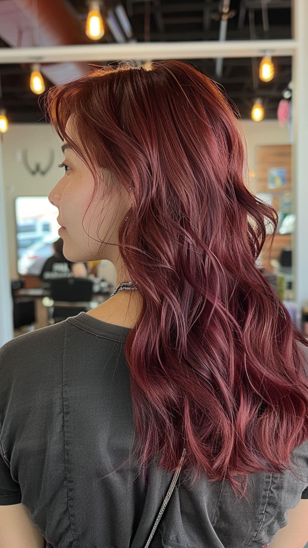 A woman modelling a burgundy hair.