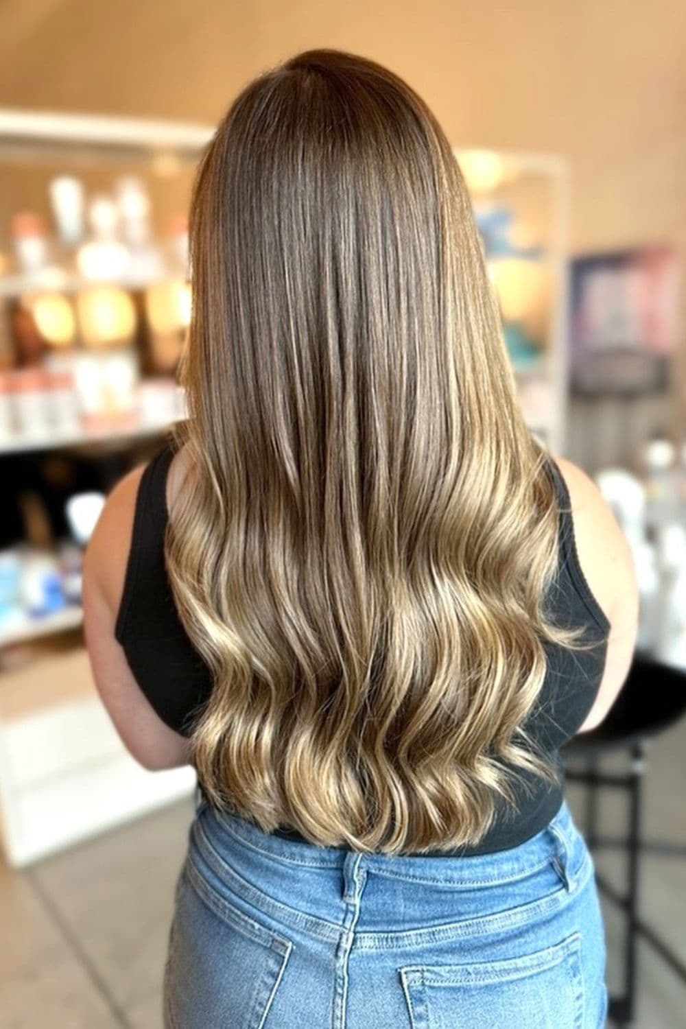 A woman with dirty blonde balayage.