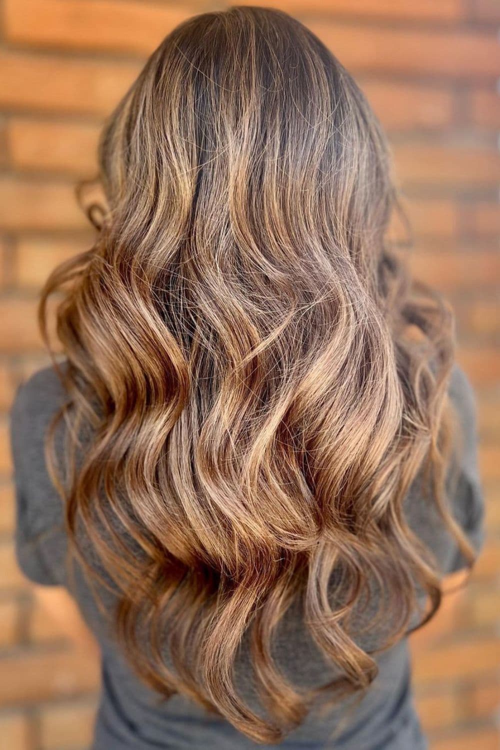 A woman with long dirty bronde hair.