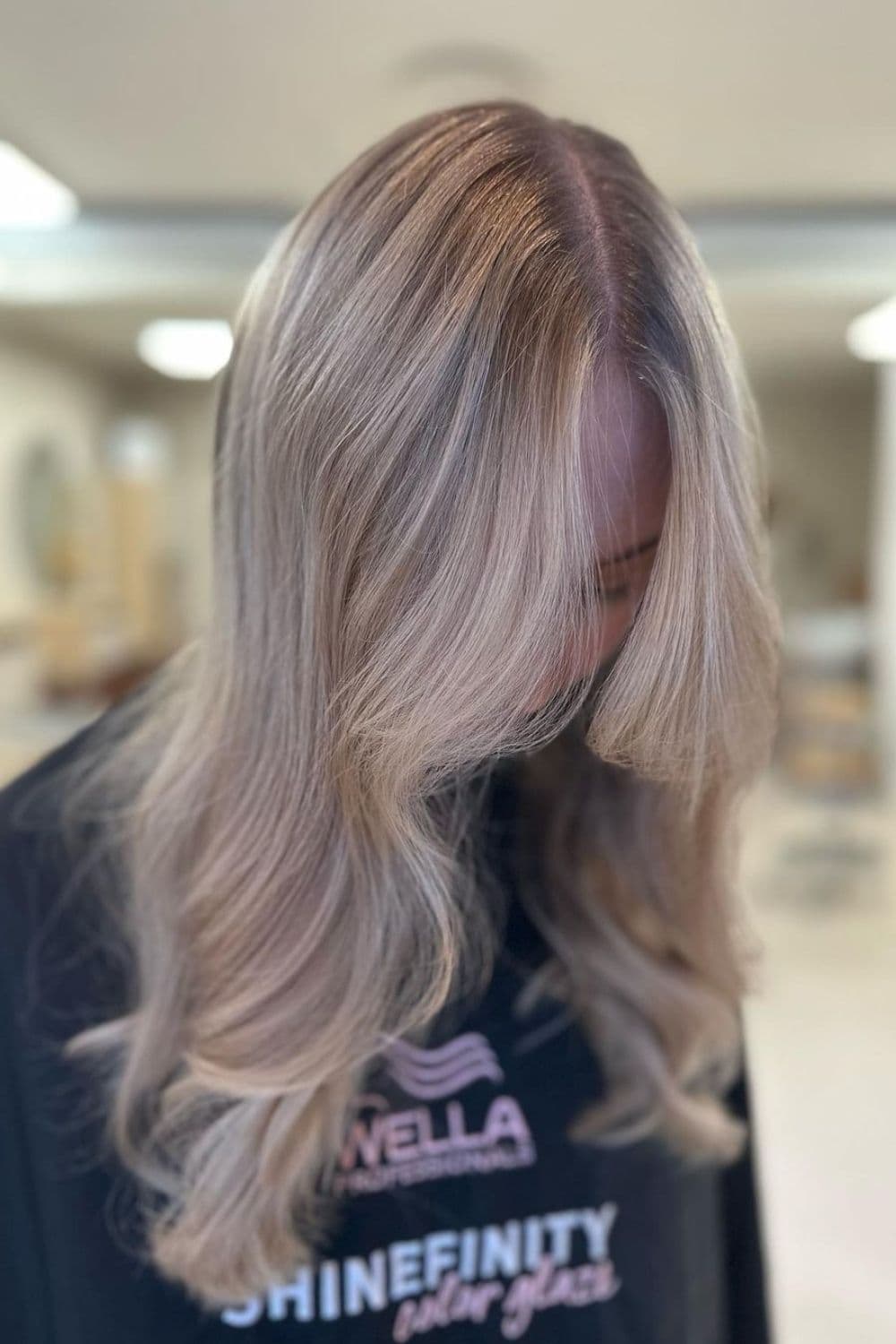 A woman with long dusty blonde hair.