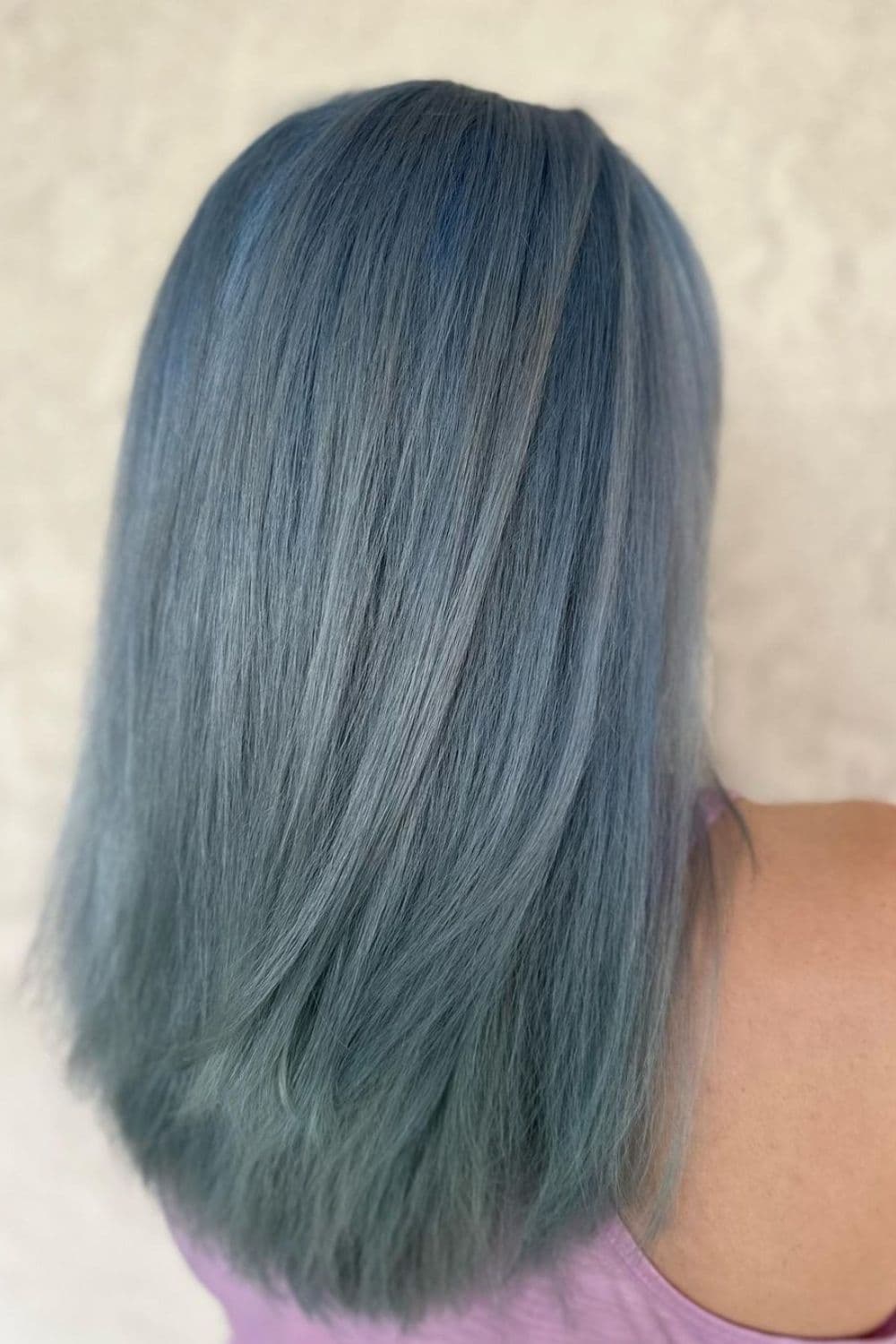 A woman with medium-length ice blue hair.